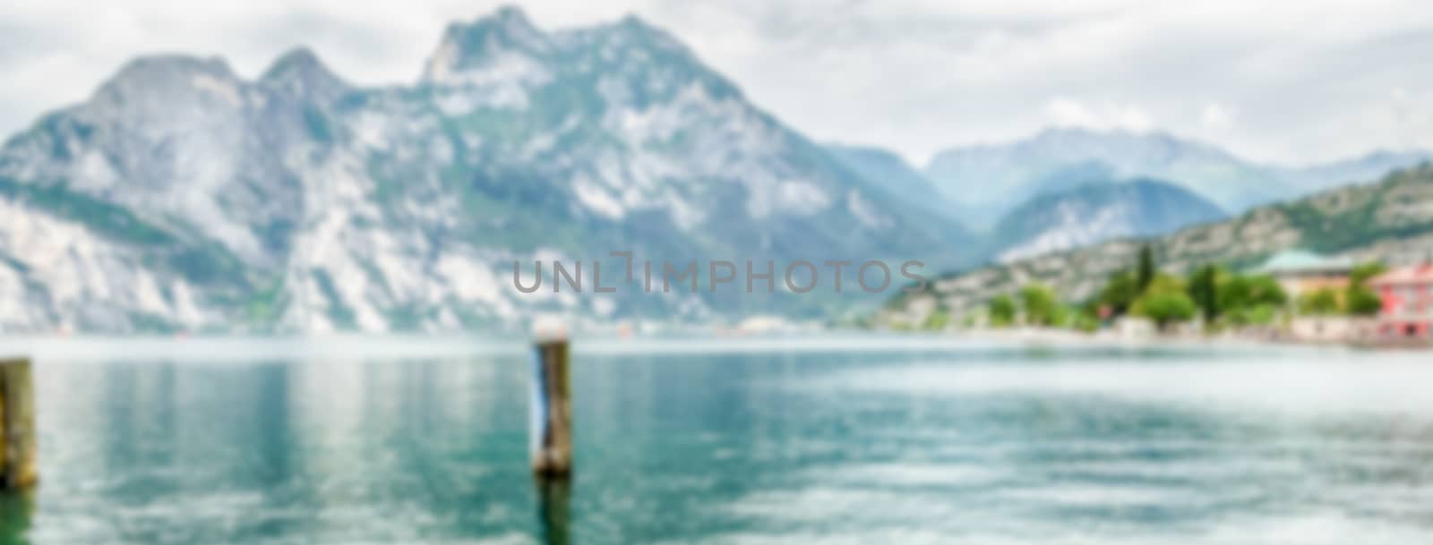 Defocused background of Lake Garda from Torbole town, Italy by marcorubino