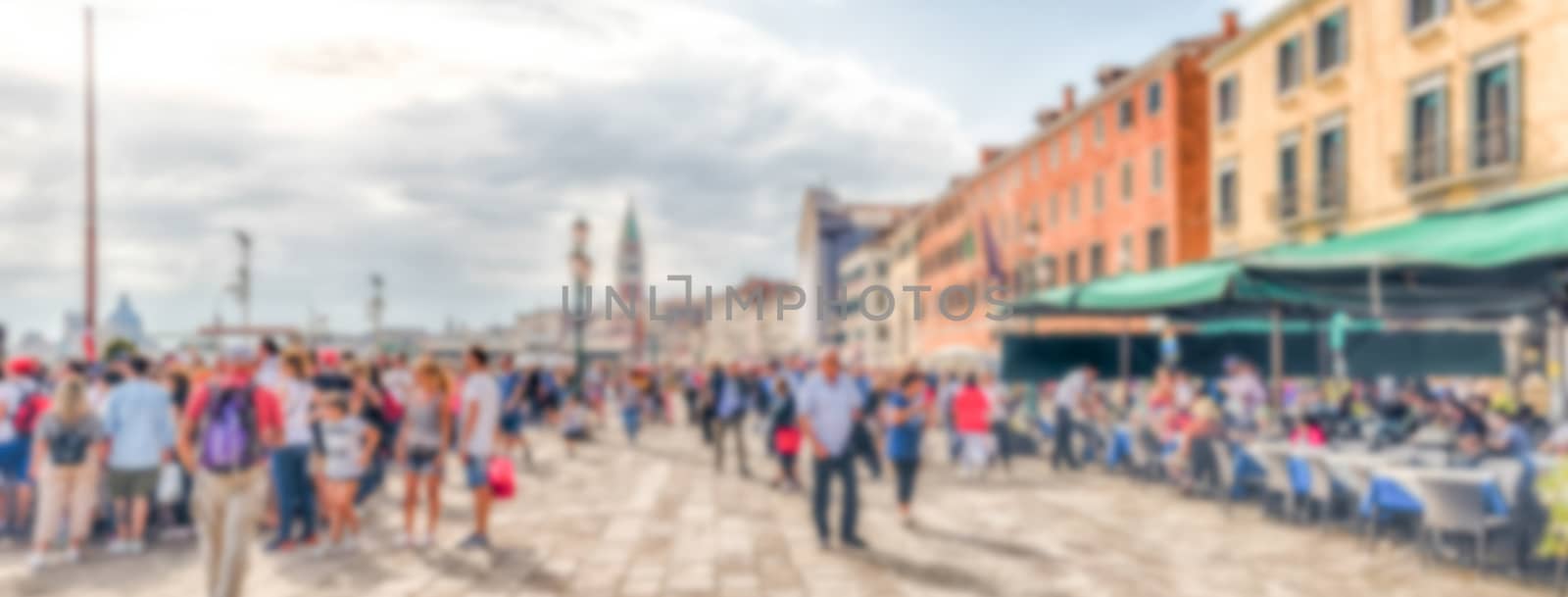 Defocused background of  Riva degli Schiavoni, scenic promenade and waterfront next to St Mark's square, Venice, Italy. Intentionally blurred post production for bokeh effect