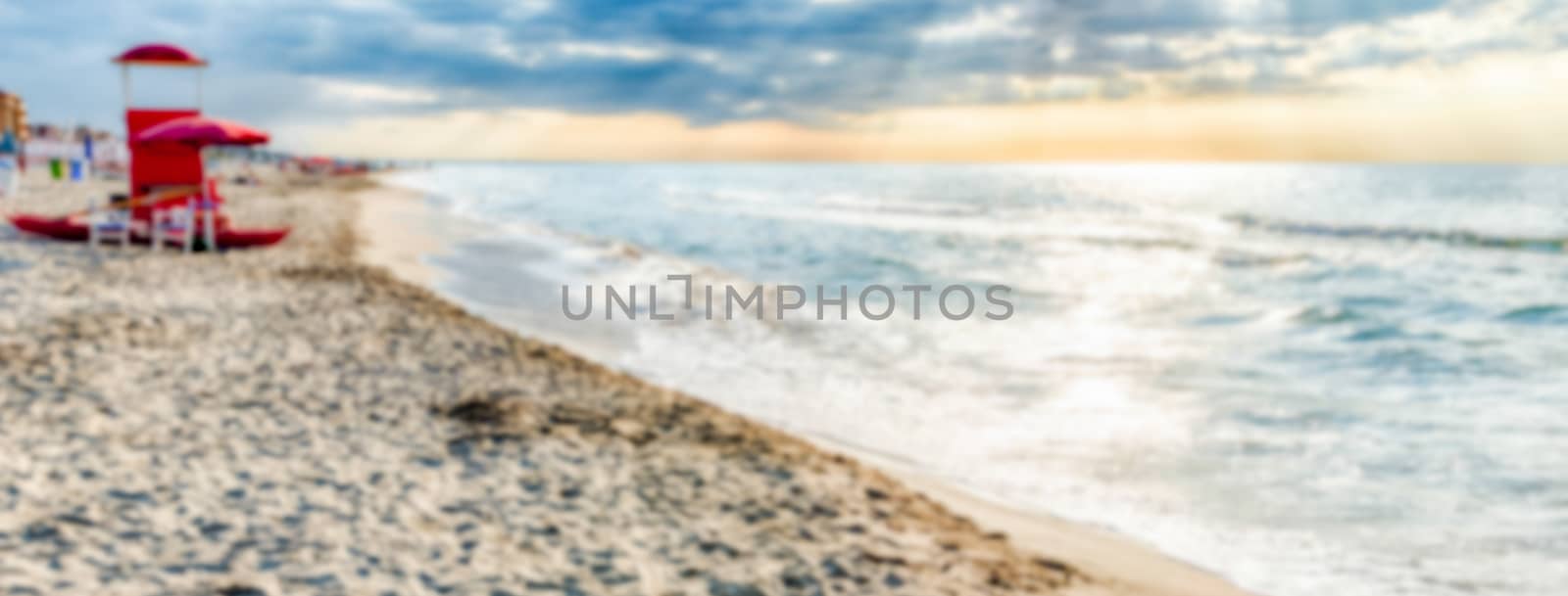 Defocused background of a scenic beach in central Italy by marcorubino