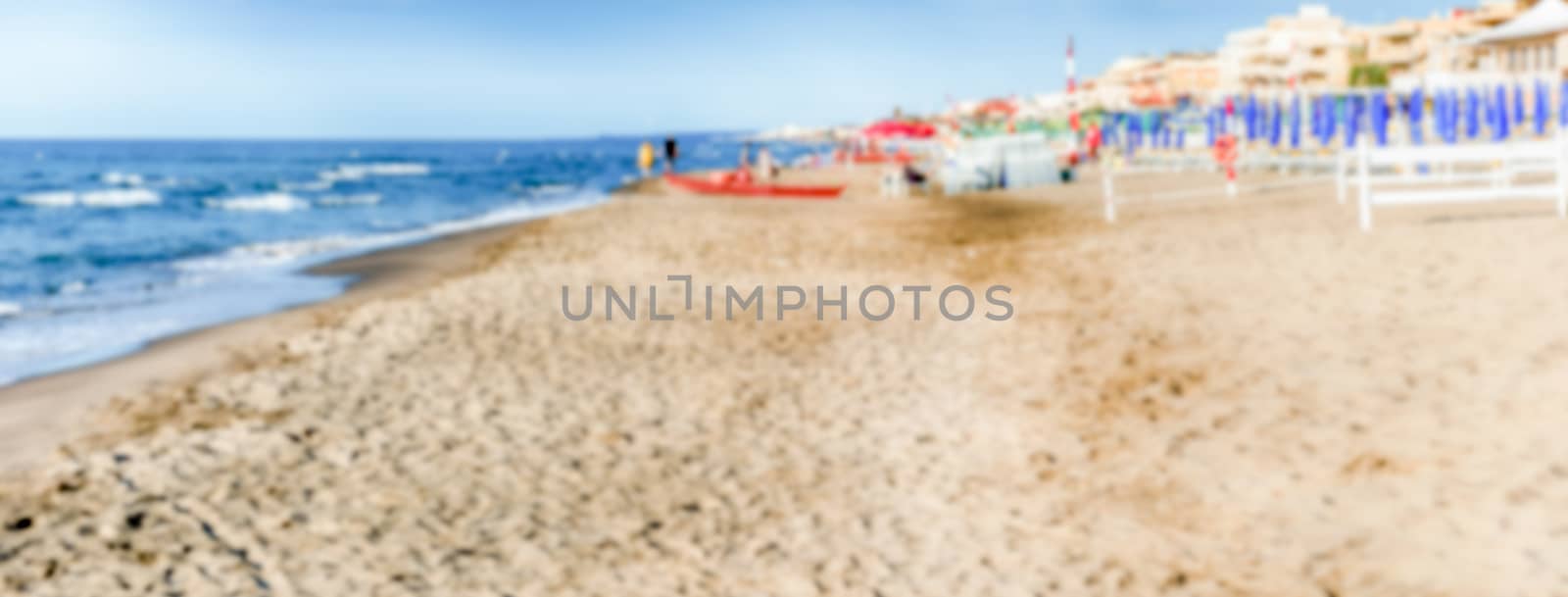 Defocused background of a scenic beach on the thyrrenian coastline in central Italy. Intentionally blurred post production for bokeh effect