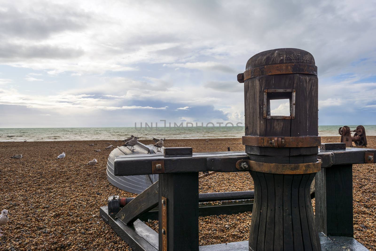 Seagulls standing on a small boat in Brighton's beach by ankarb