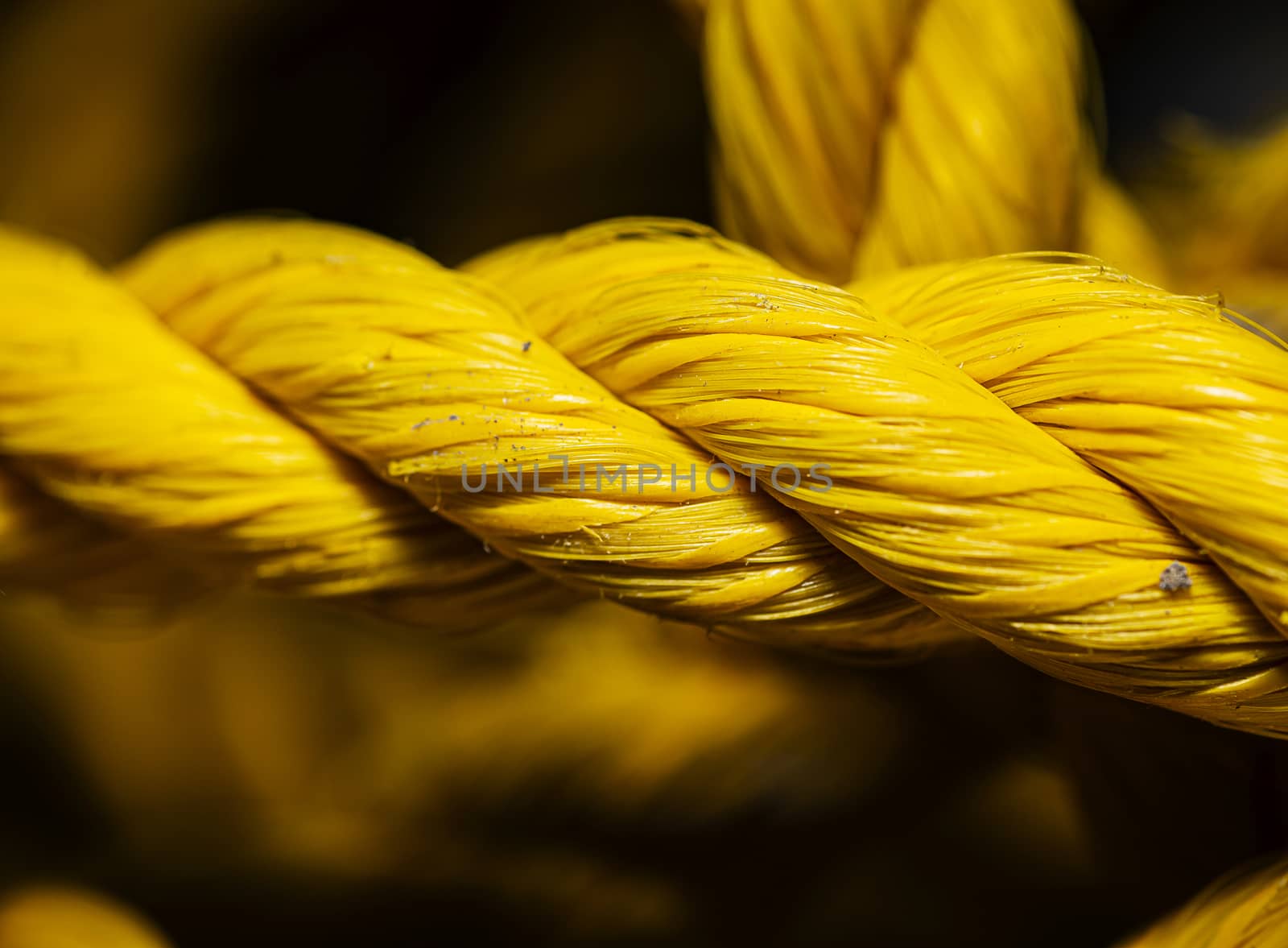 Macro shot of a large yellow construction nylon rope