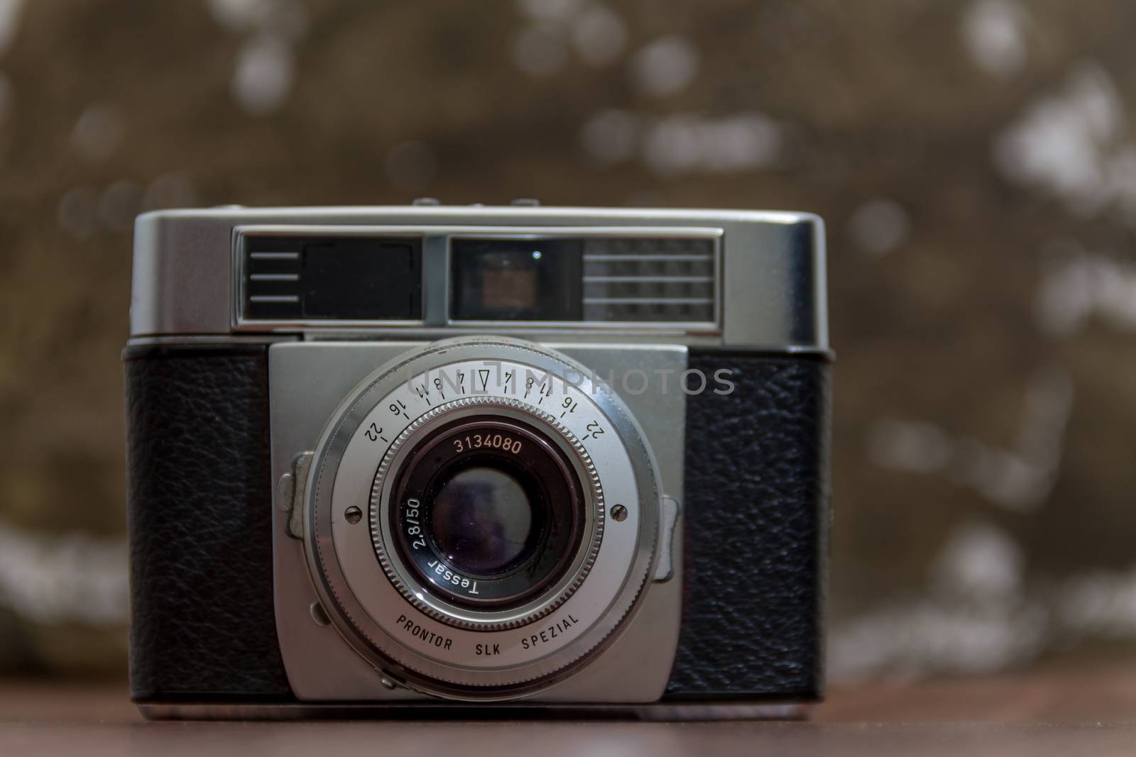 Antique Vintage Old Film Camera on organic background