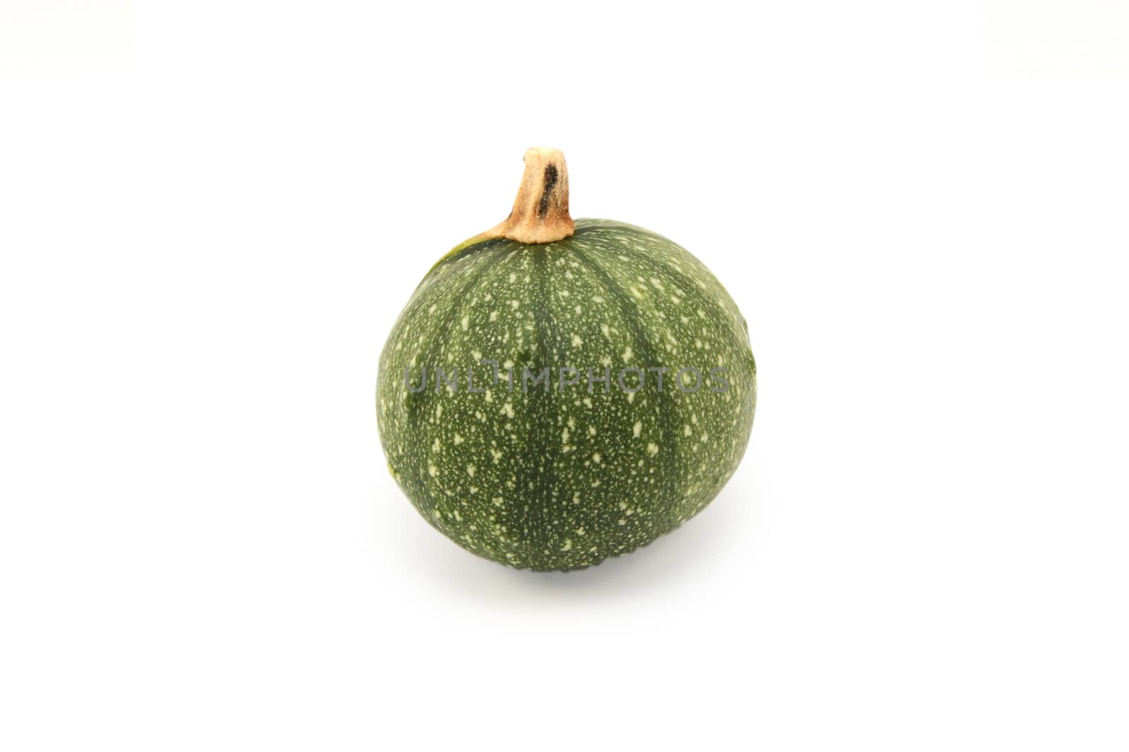 Small round ornamental gourd with green skin for decoration, on a white background