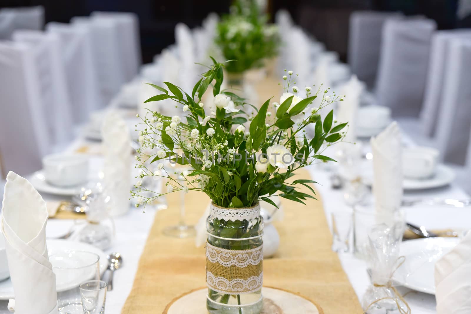 Wedding table set for fine dining or other catered event, center-piece