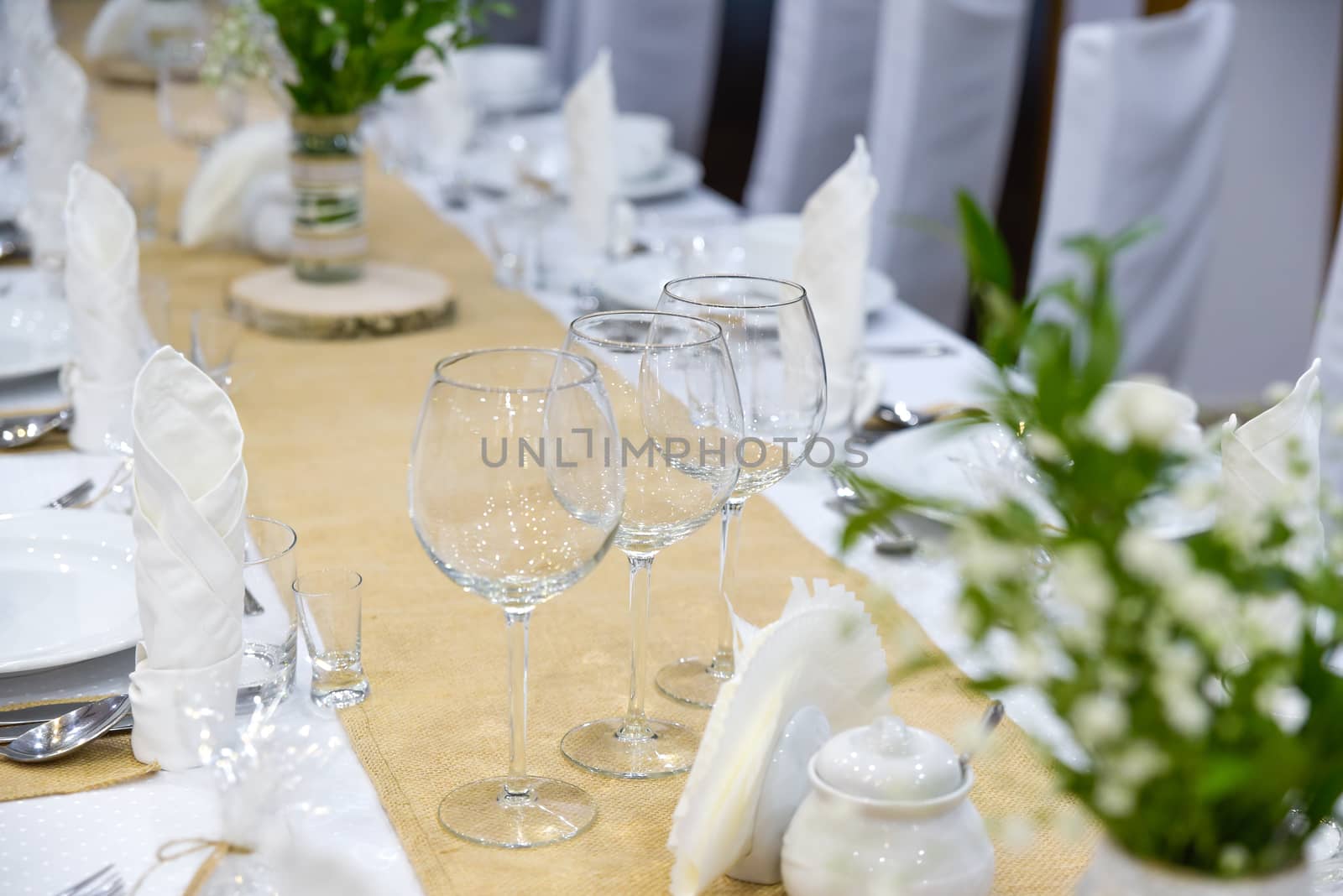 Wedding table set for fine dining or other catered event, center-piece