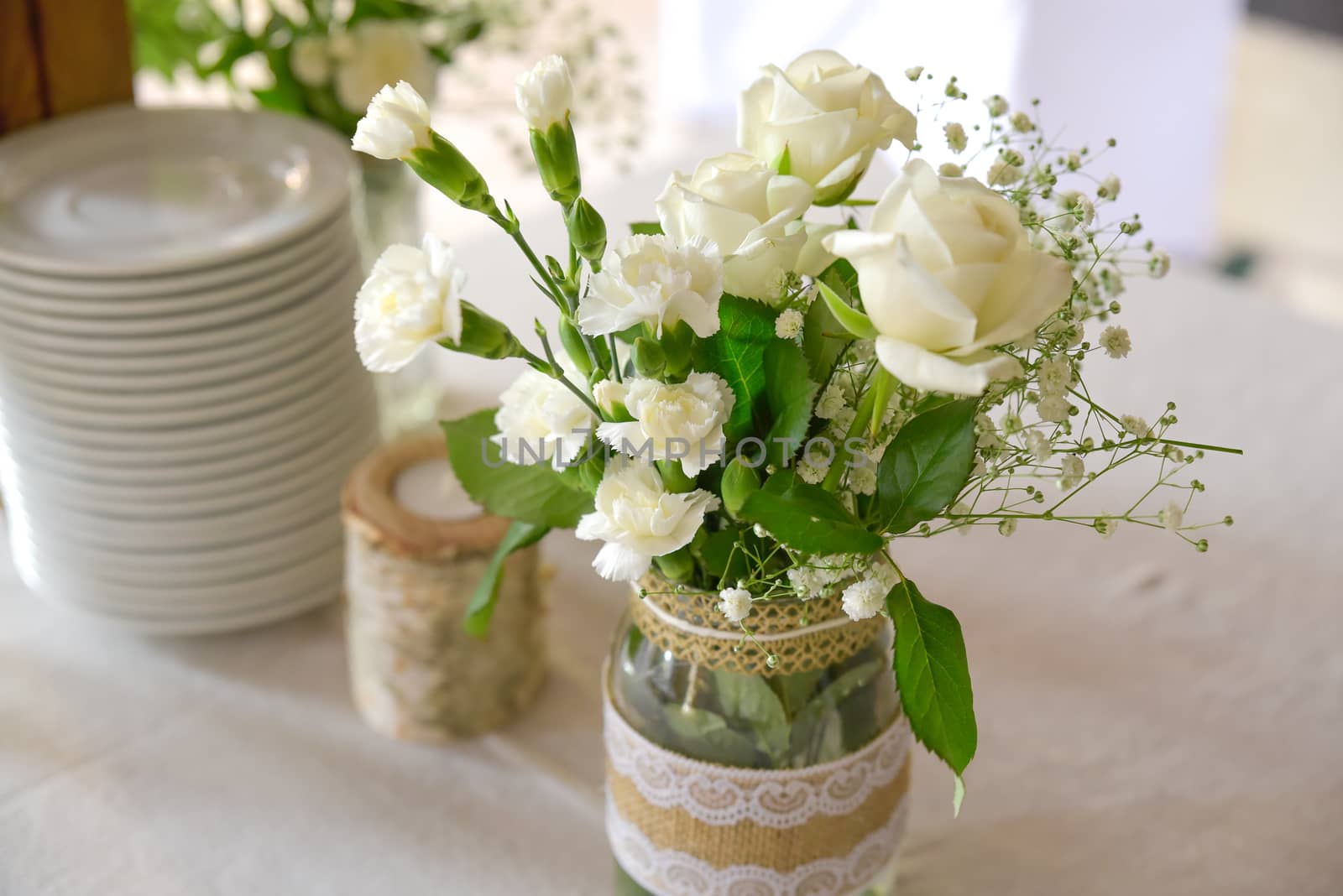 Wedding table set for fine dining or other catered event, center-piece