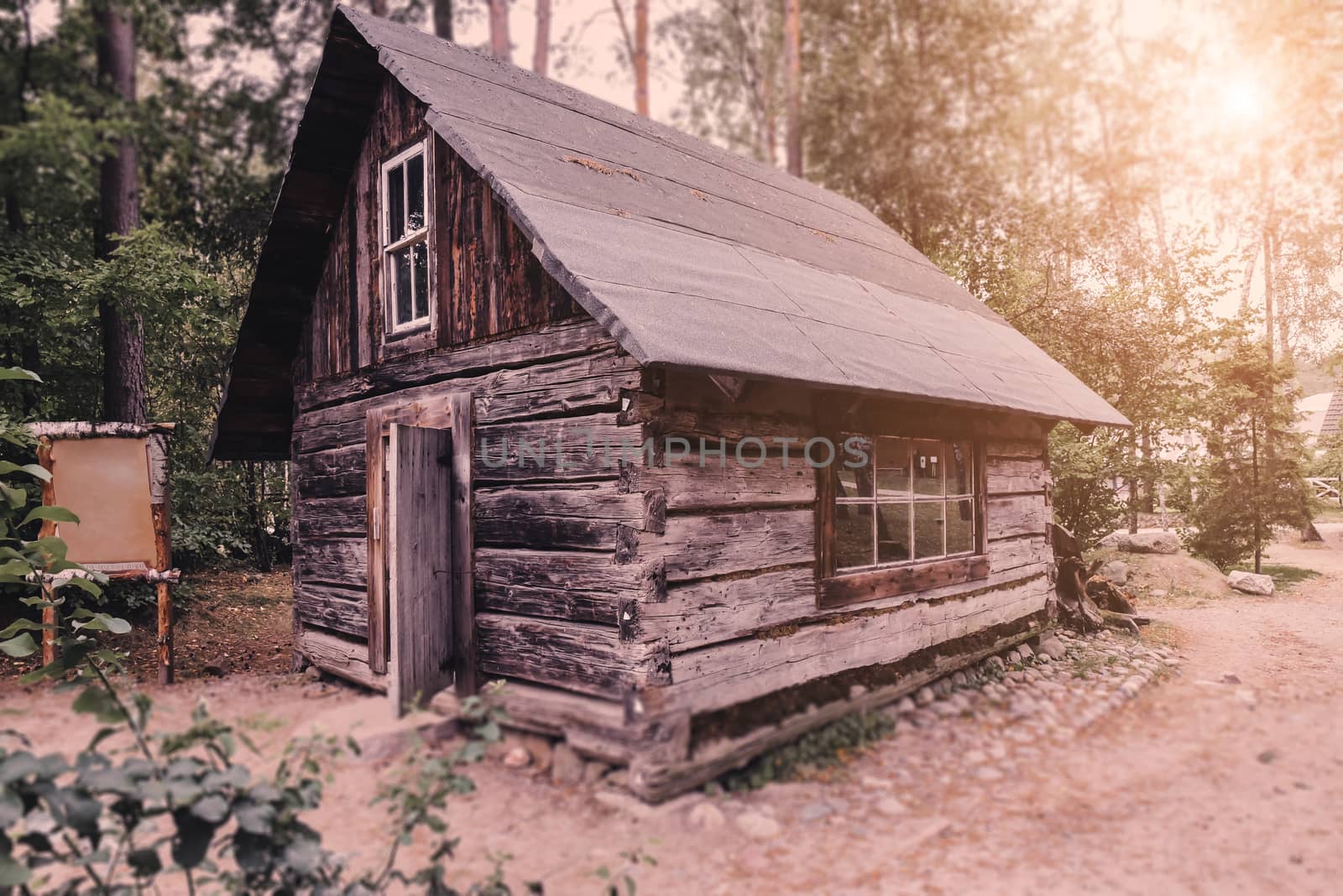 Abandoned old wooden house Cabin in the woods.  View of old weathered wooden