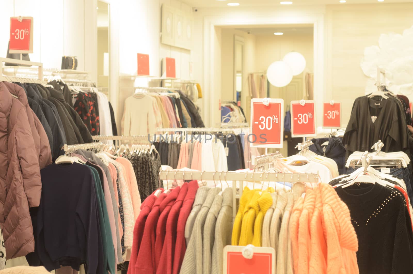 sale of clothes with 30 percent discount in the store or shopping centre