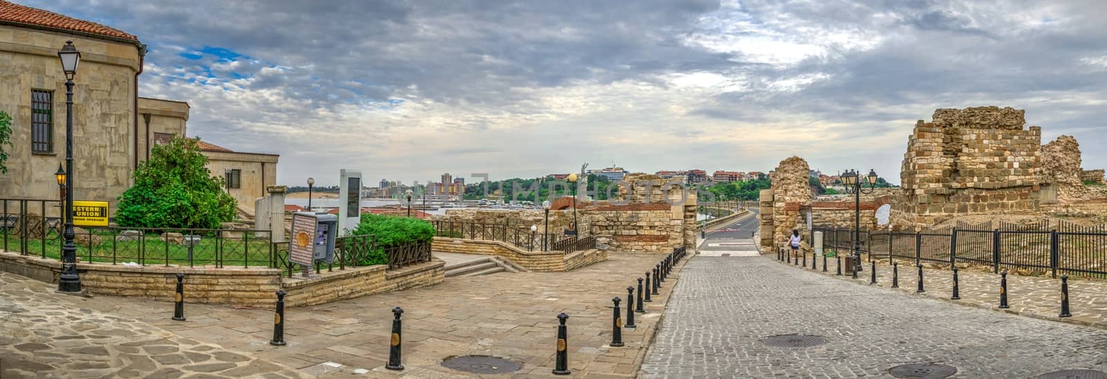 Nessebar, Bulgaria – 07.10.2019.  Ruins of ancient fortifications at the entrance to the Old Town of Nessebar, Bulgaria, on a cloudy summer morning