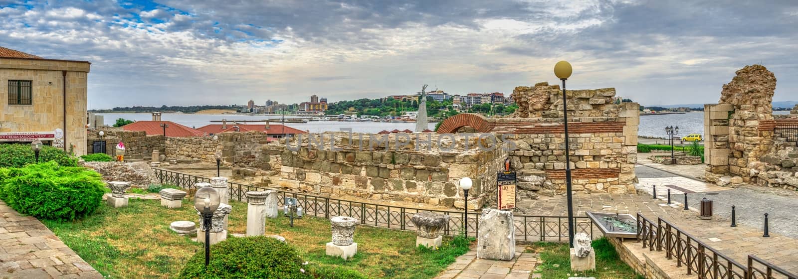 Nessebar, Bulgaria – 07.10.2019.  Ruins of ancient fortifications at the entrance to the Old Town of Nessebar, Bulgaria, on a cloudy summer morning