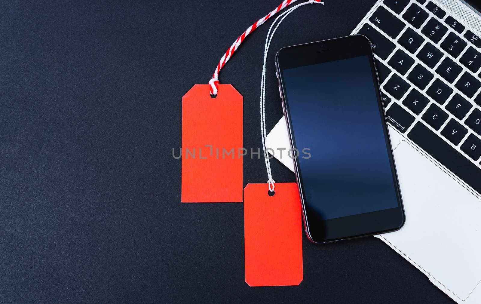 Online shopping Blank red 2 tag on smart phone and laptop comput by Sorapop