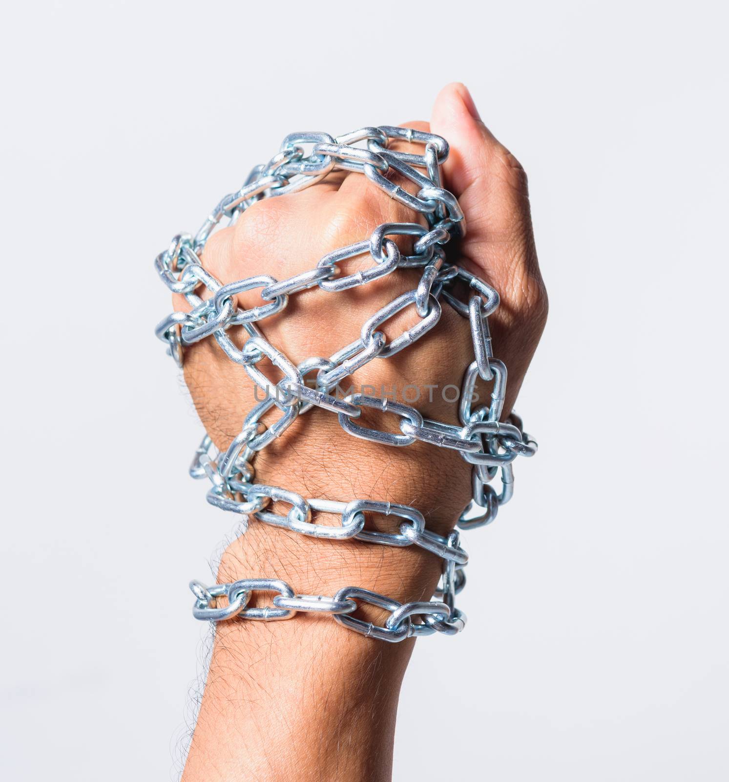 Chained fist hands on white background, Human rights day concept
