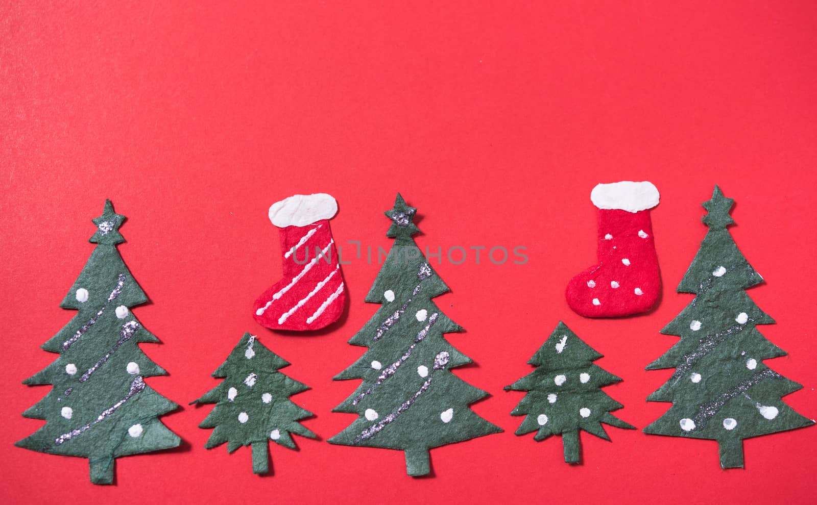 Christmas green tree and sock on red backgroun, have copy space for use