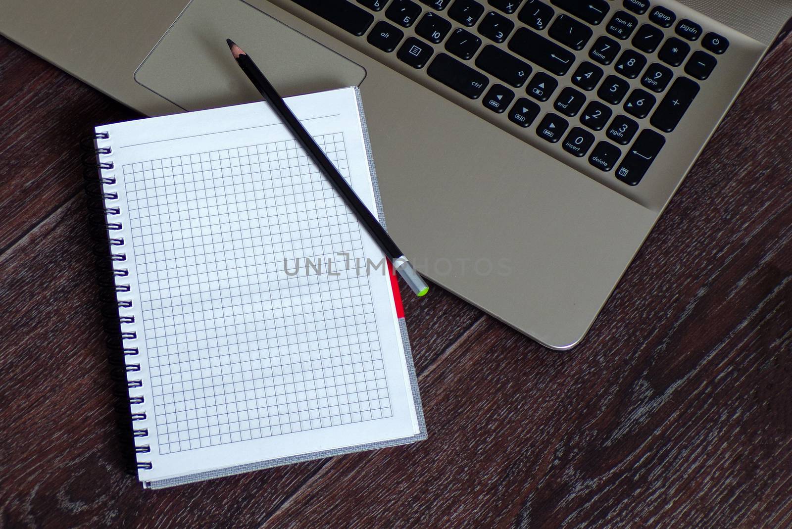 Office Desk with empty notebook and laptop. Job. Wooden table.