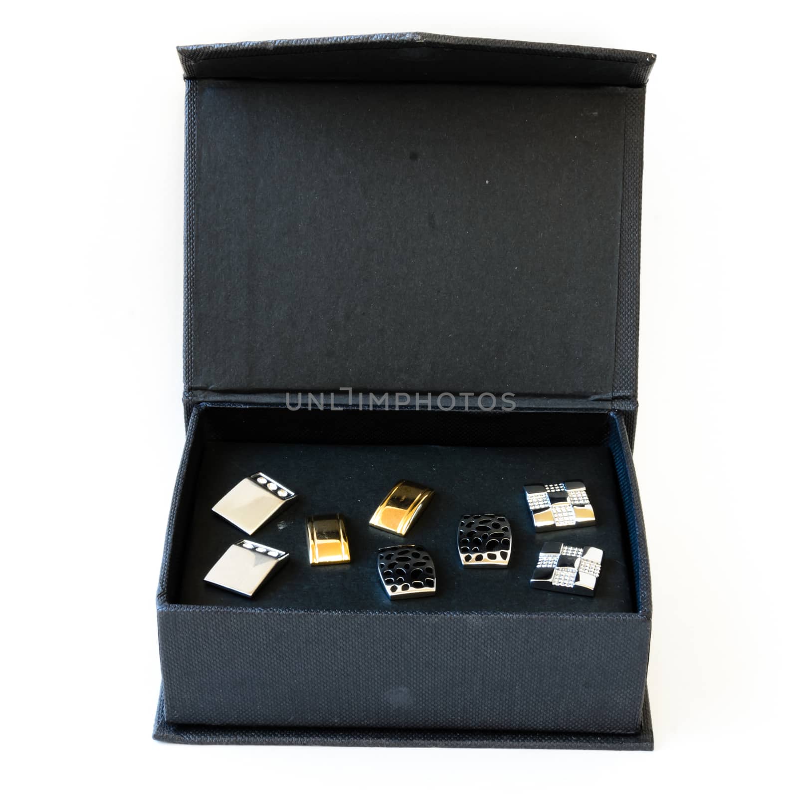 Black fashionable box of modern stainless steel cufflinks isolated on white background. Lifestyle trendy clothing accessories dress with clipping path and copy space.