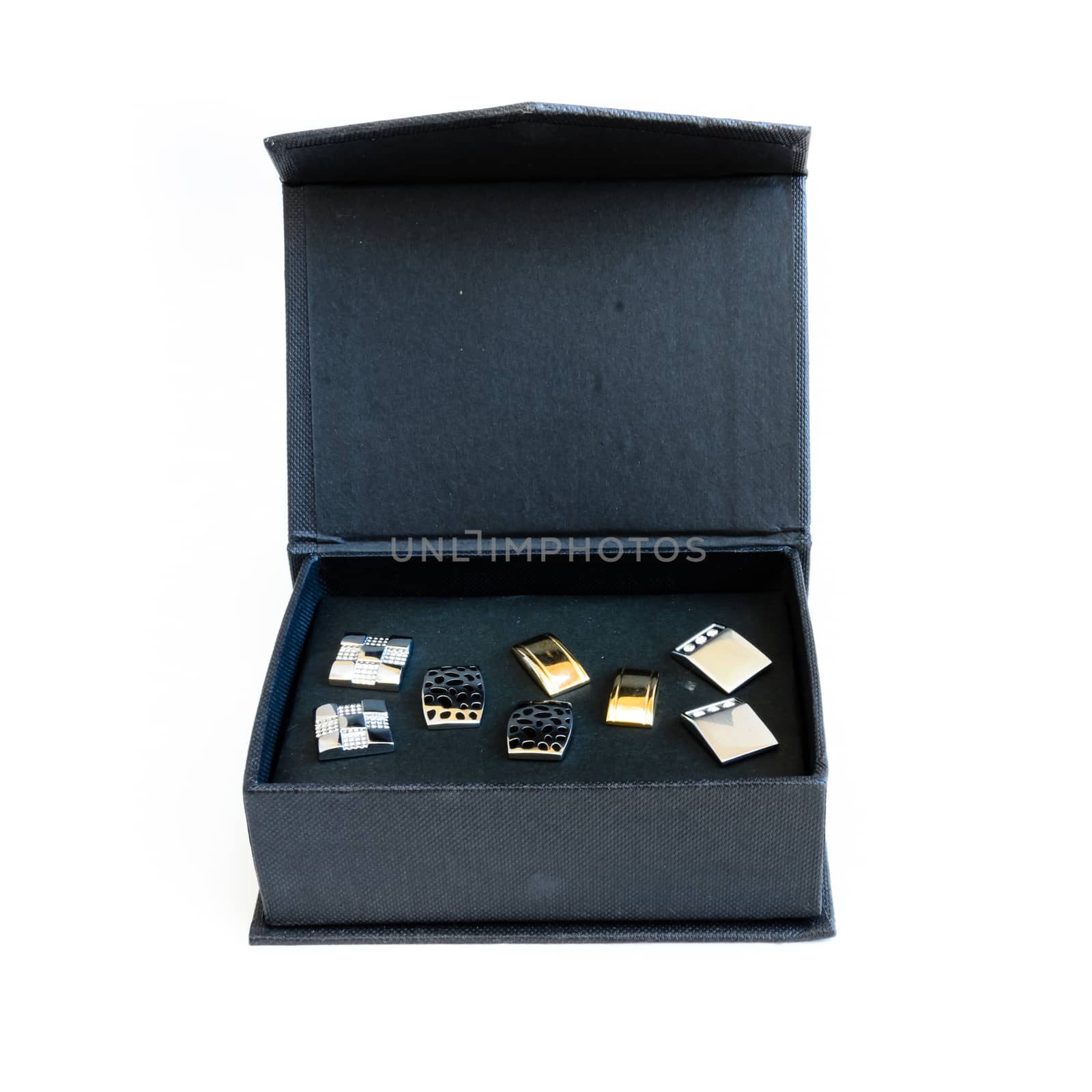 Black fashionable box of modern stainless steel cufflinks isolated on white background. Lifestyle trendy clothing accessories dress with clipping path and copy space.
