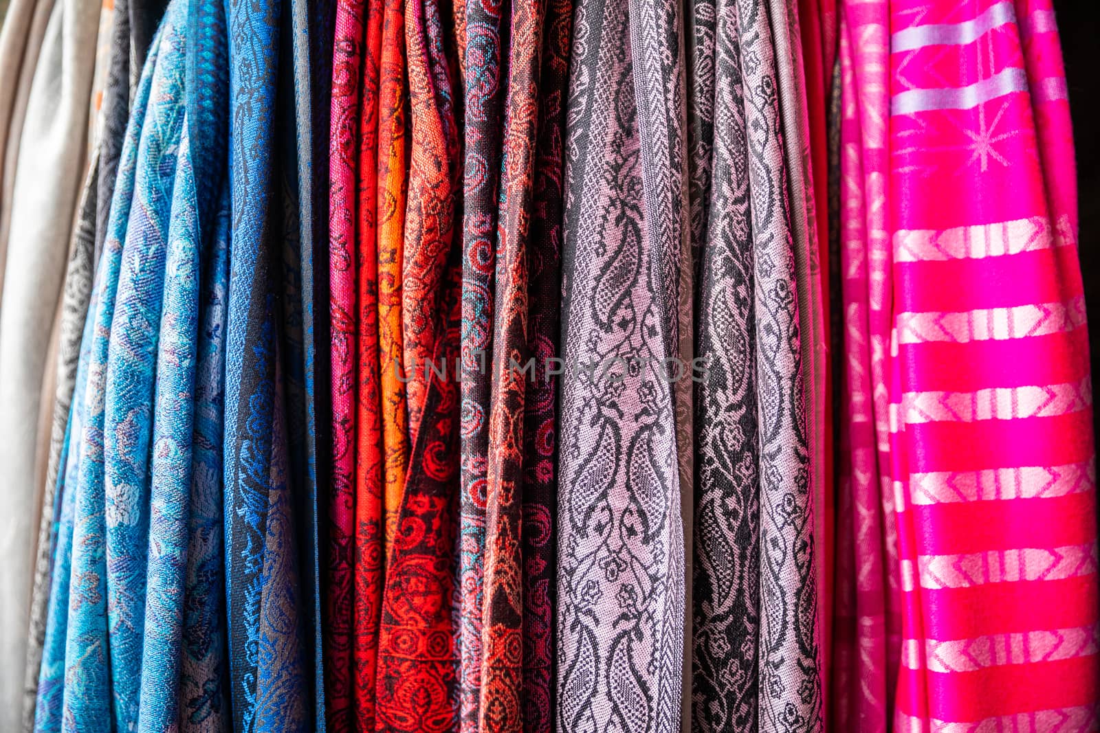 Different color of fabric cloths gathering in vertical hanging by jack-sooksan