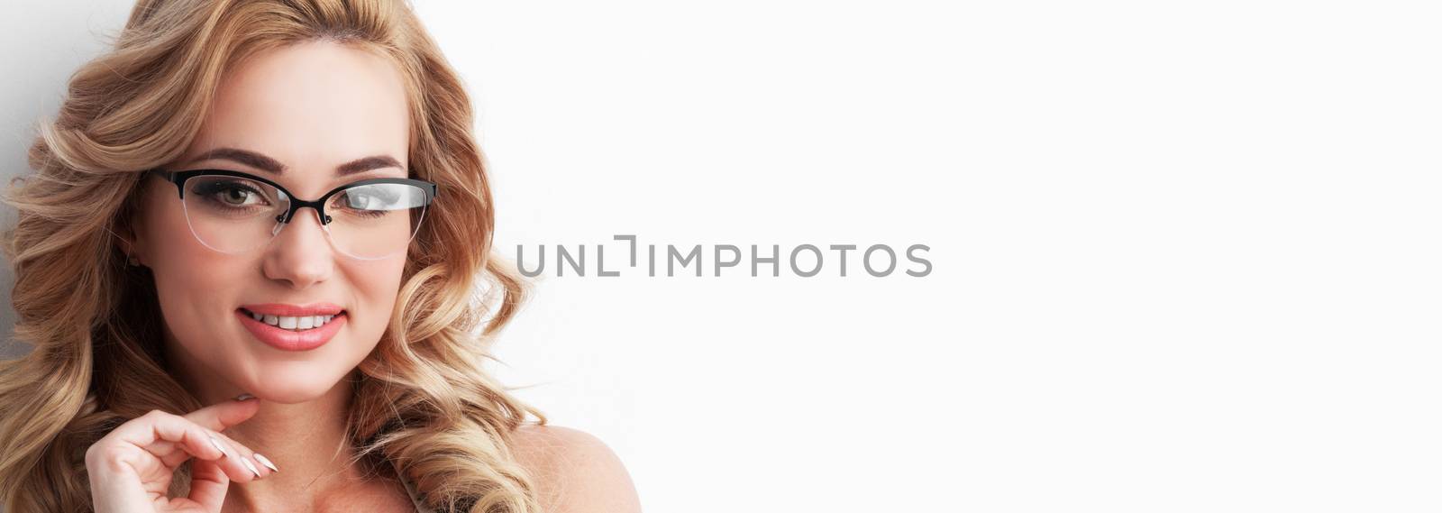 Young lovely caucasian curly-haired gorgeous blonde woman wearing eye glasses isolated on white background with copy space for text