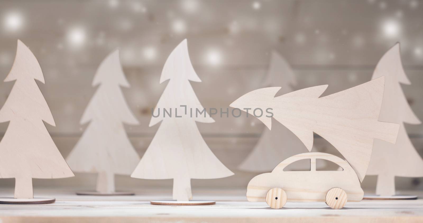 Christmas background. Toy handmade wooden car with christmas tree. Merry Christmas and Happy New Year background