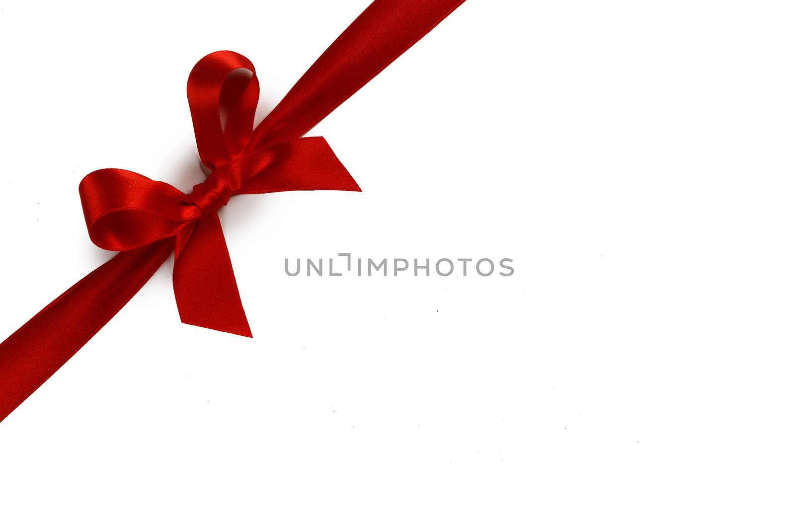 Elegant satin red ribbon bow isolated on white background