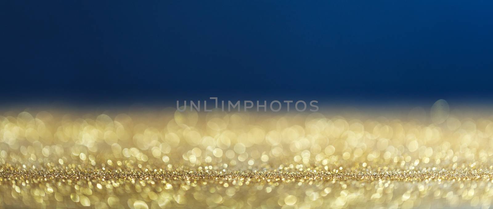 Golden and blue christmas background with bokeh lights