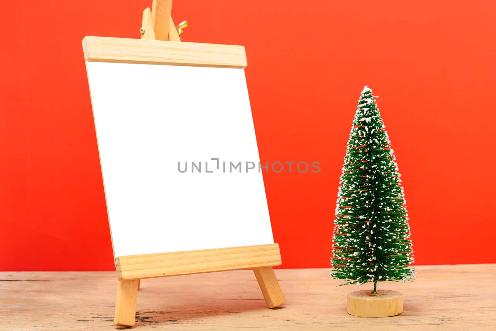 Christmas composition decorations, minimal green fir tree branch by Sorapop