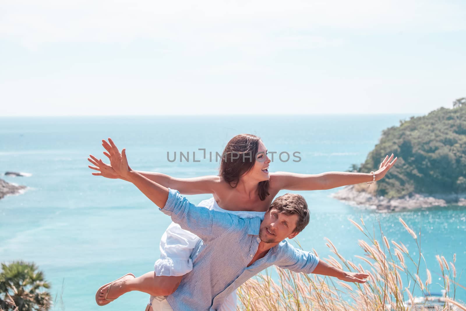 Happy smiling couple on vacation flying together