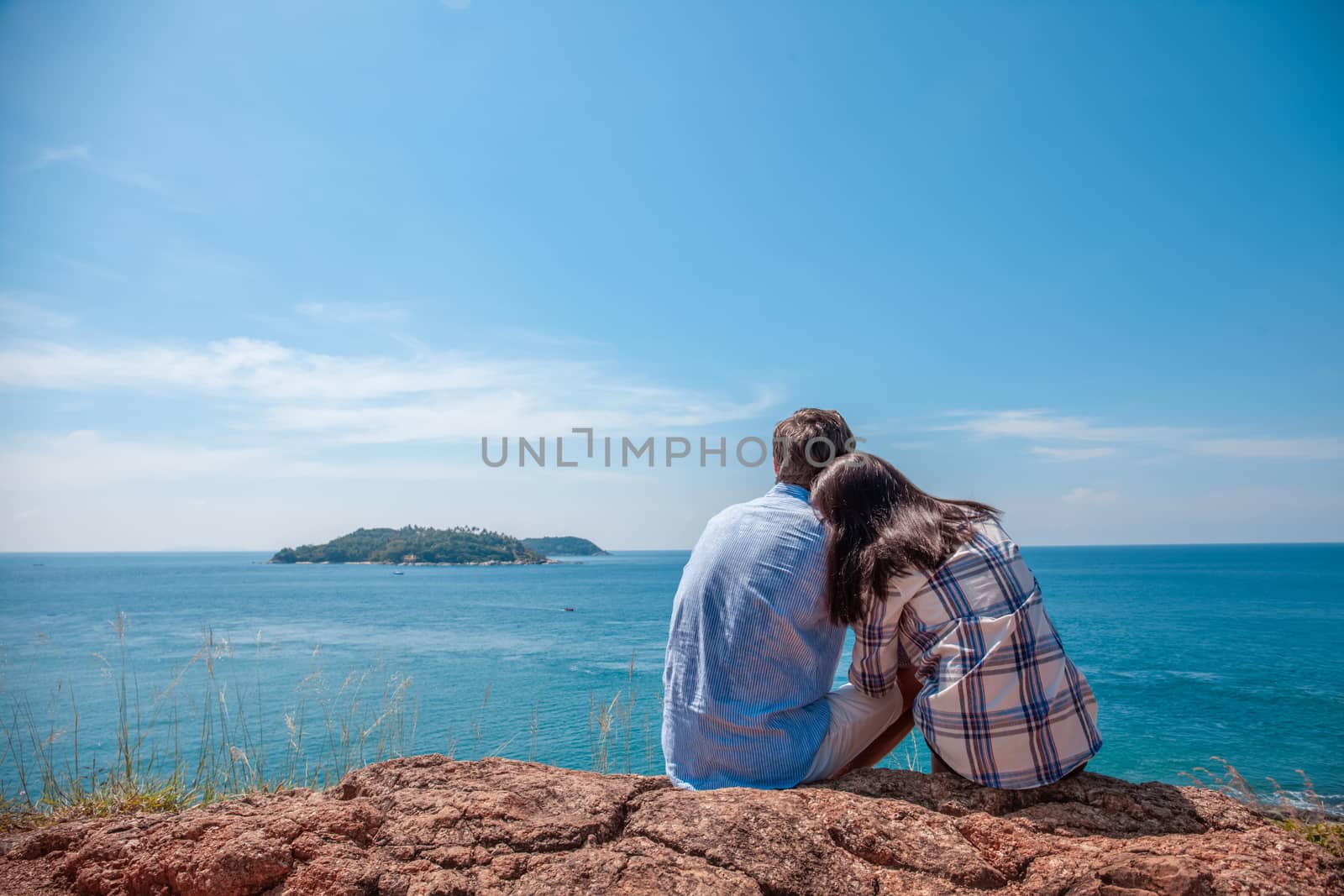 Young couple enjoy beautiful sea view on vacation