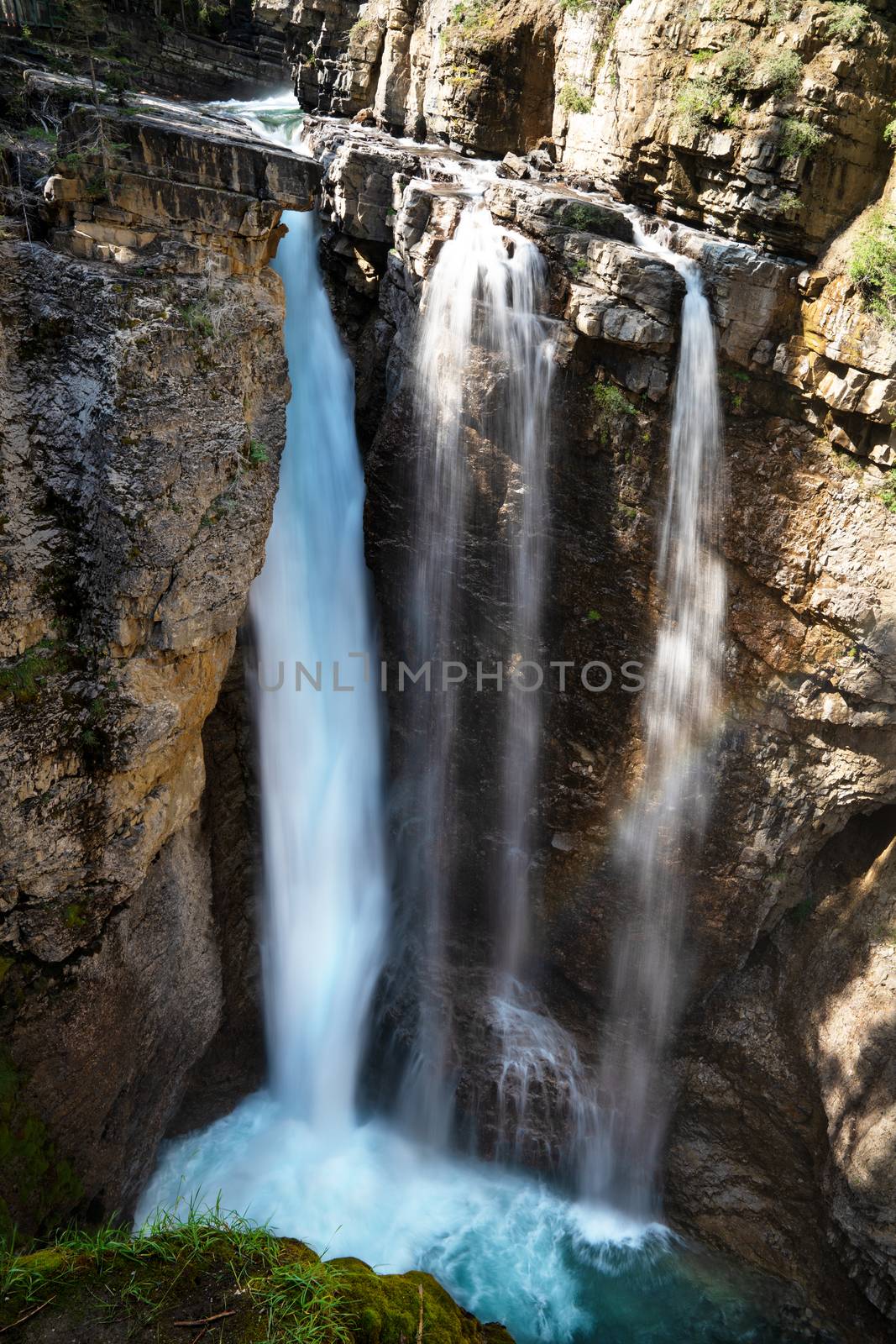 Longexposure image of a waterfall within the Johnston Canyon, Bow Valley Parkway, Banff National Park, Alberta, Canada