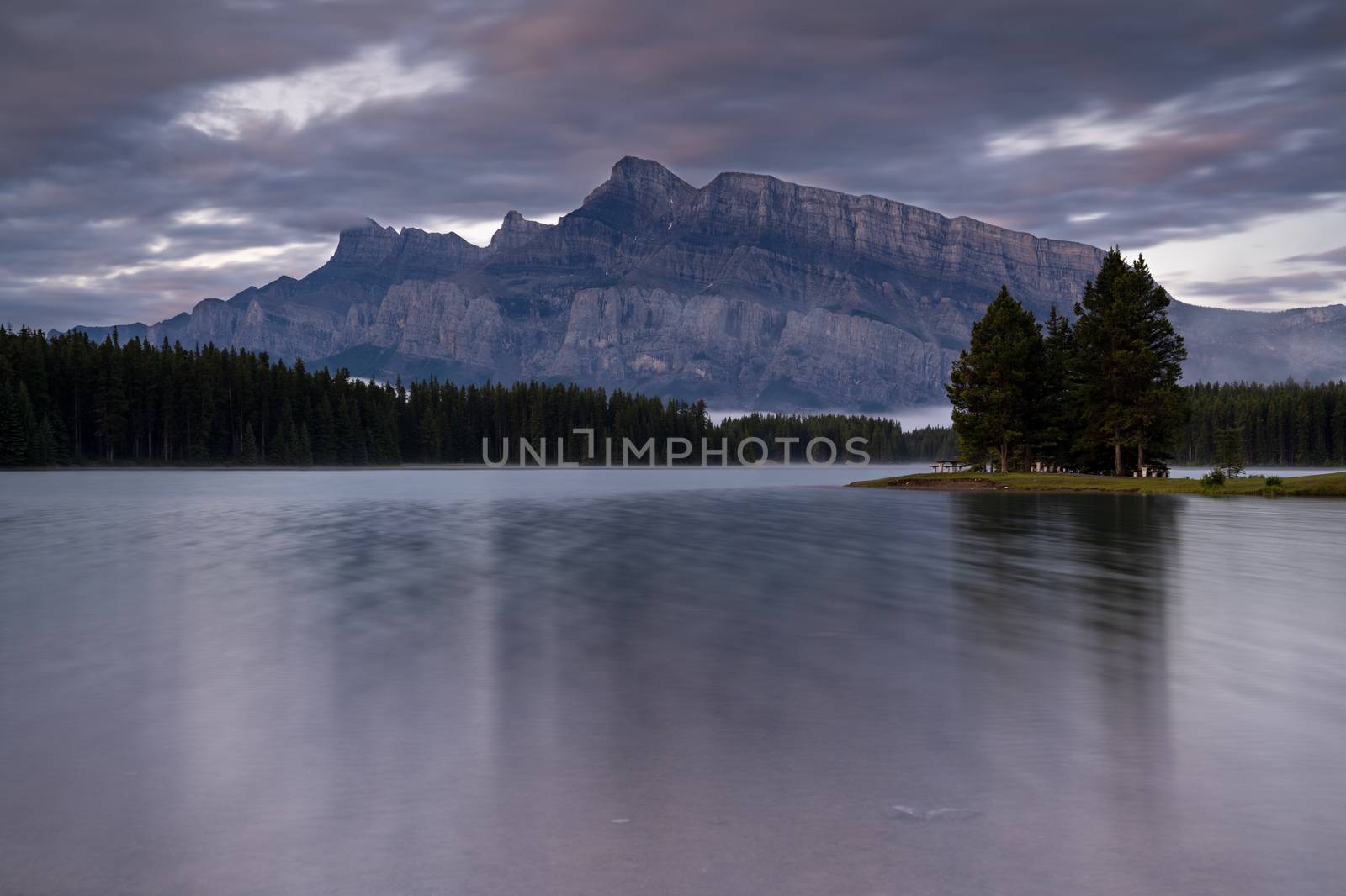 Panoramic image of Mount Rundle reflecting in Two Jack Lake with early morning mood, Banff National Park, Alberta, Canada