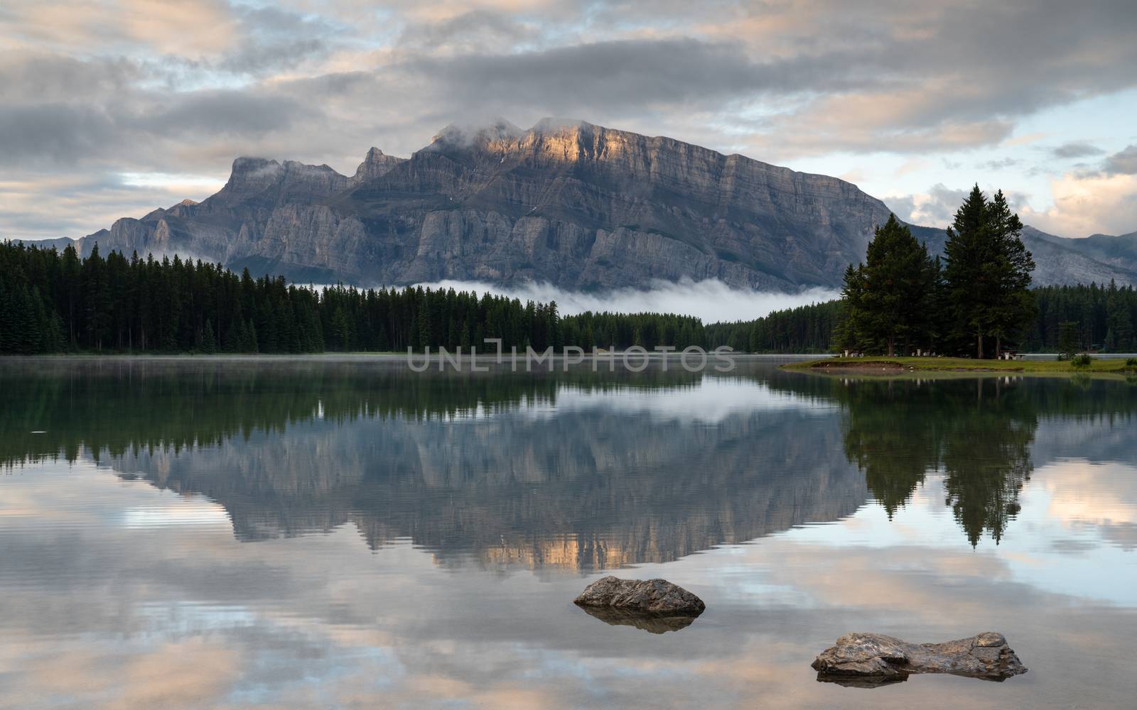 Panoramic image of Mount Rundle reflecting in Two Jack Lake with early morning mood, Banff National Park, Alberta, Canada