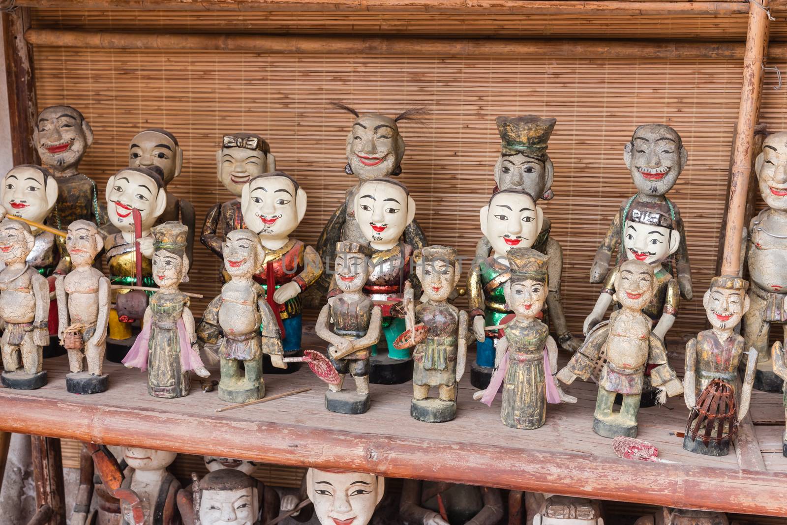 Common Vietnamese water puppets on display for sale as traditional souvenirs in Hanoi. Water puppet is a traditional art of Vietnam. Each represents a character in the life of ancient Vietnamese