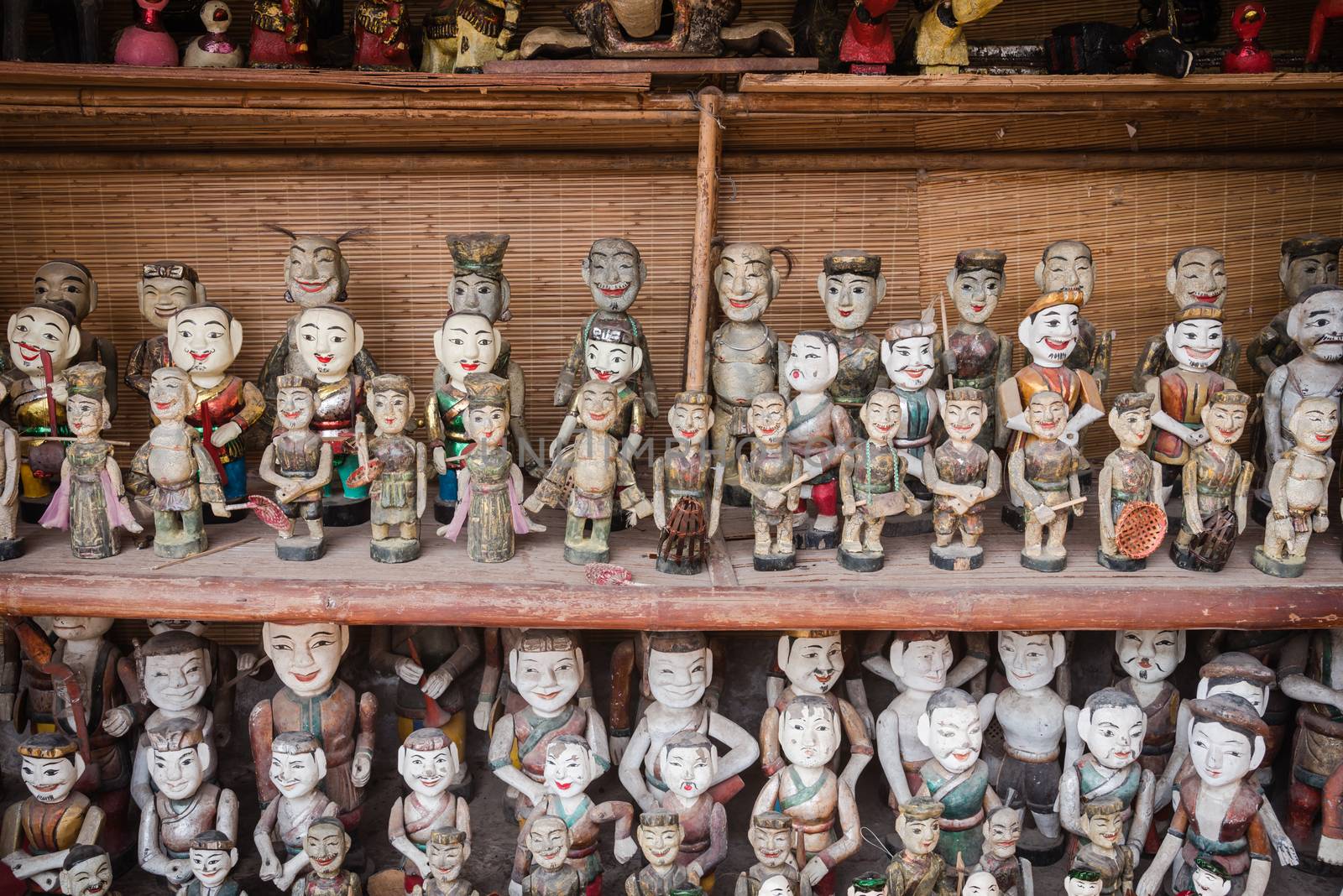 Common Vietnamese water puppets on display for sale as traditional souvenirs in Hanoi. Water puppet is a traditional art of Vietnam. Each represents a character in the life of ancient Vietnamese