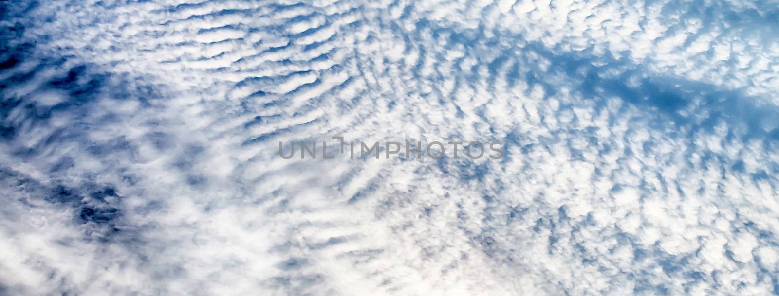 Blue Sky with Stripes Clouds Texture with copy space, may use as background