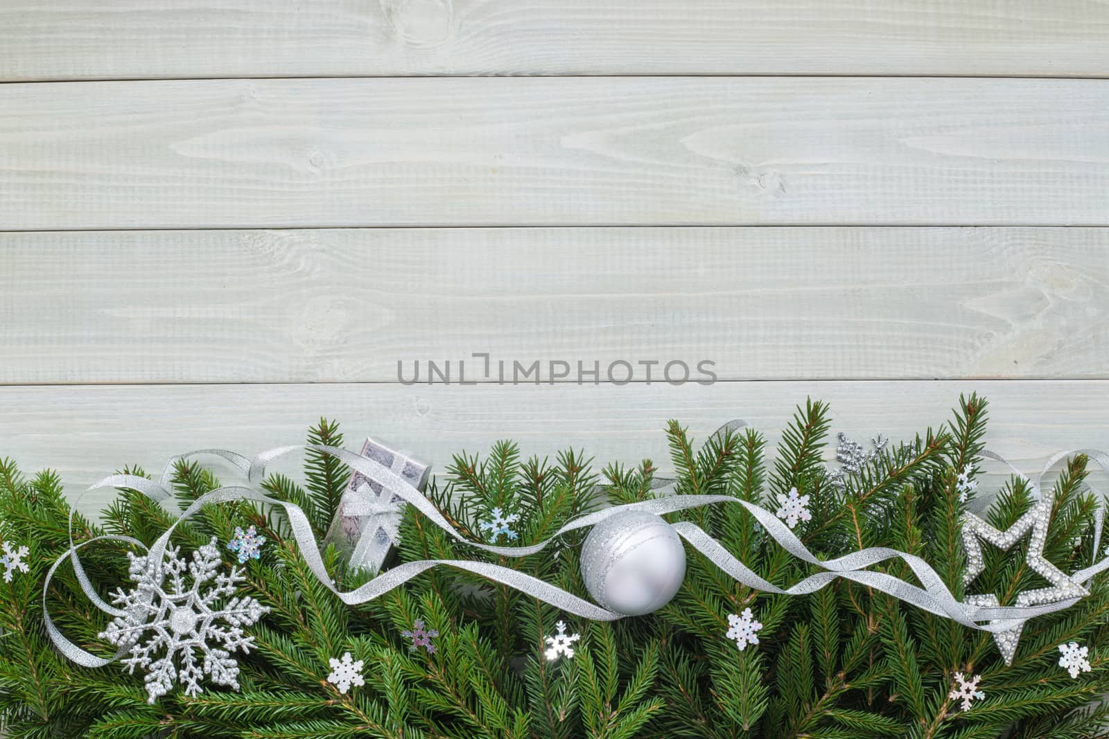 Christmas new year flat lay bauble decor and fir branches on white toned natural wooden plank background texture provence style with copy space for text