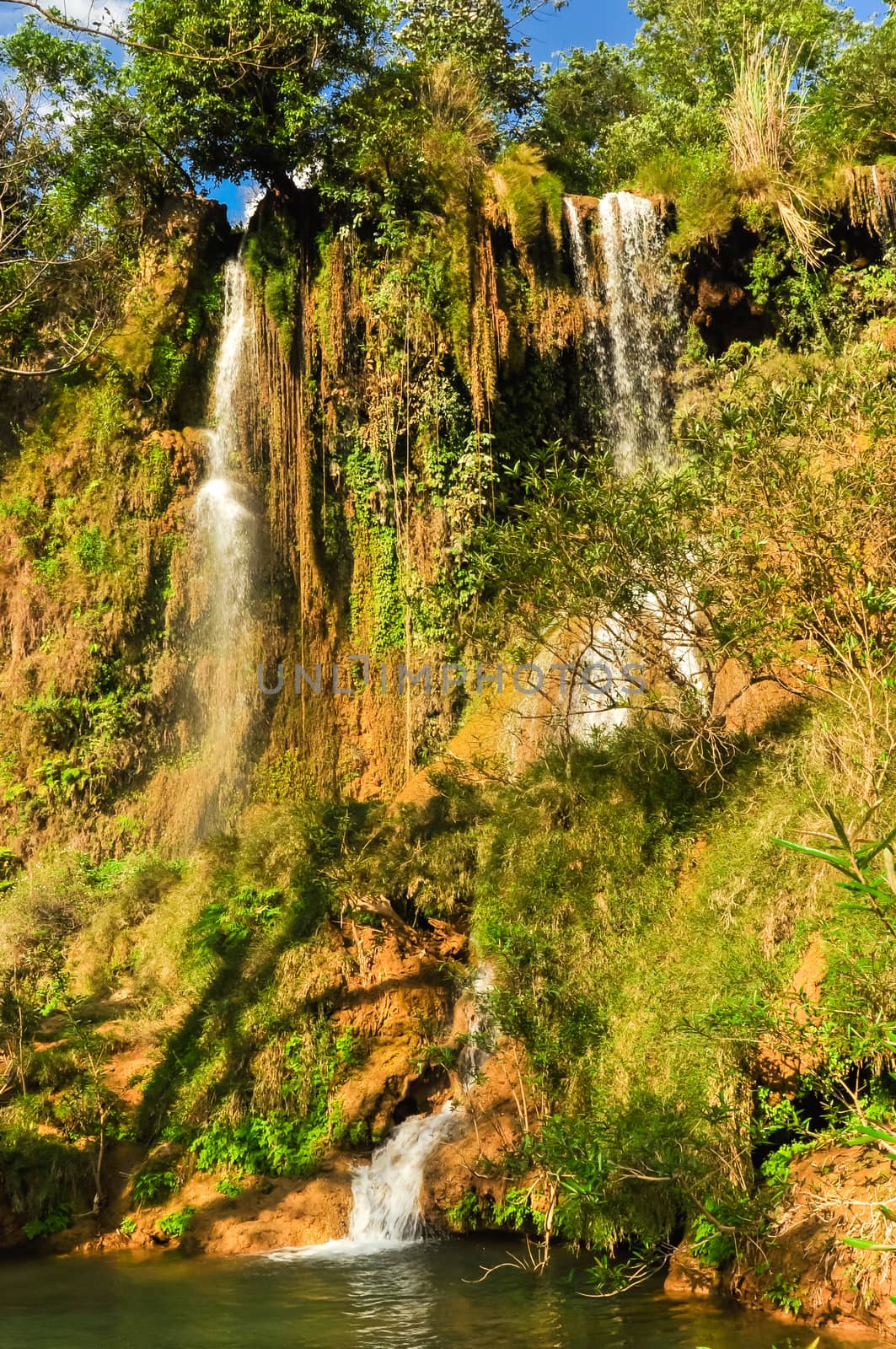 Small current fall gushes down dazzling white in Dai Yem (Pink Blouse) waterfall, Moc Chau, Vietnam by trongnguyen