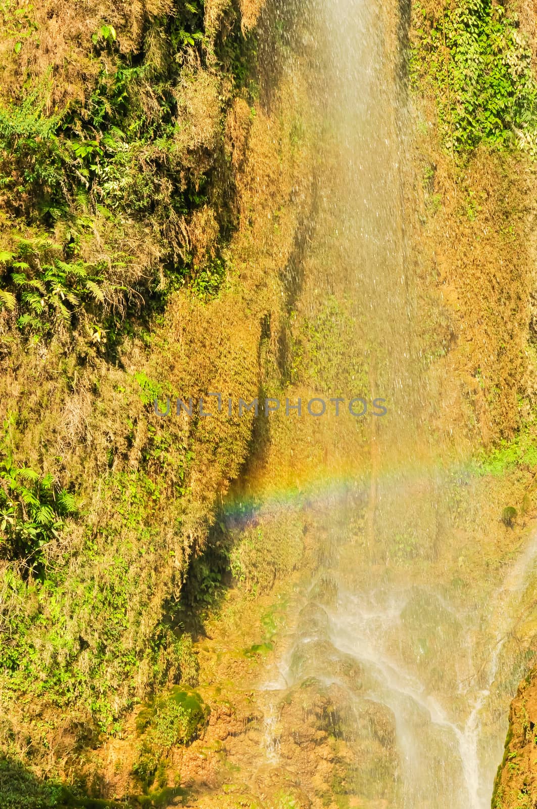 Beautiful rainbow waterfall Dai Yem (Pink Blouse) with small current gushes down in Son La, Vietnam by trongnguyen