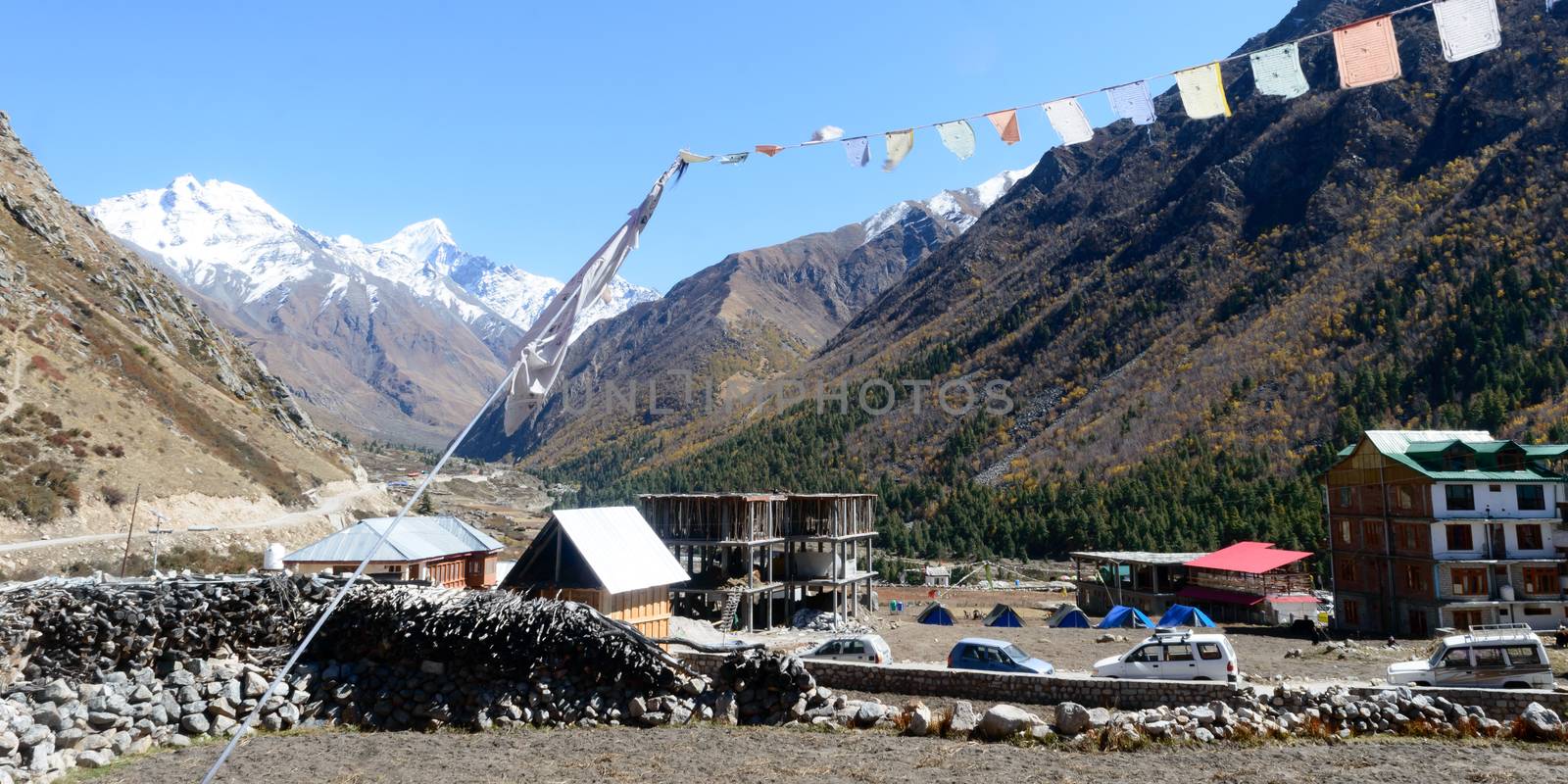 Chitkul india May 2019 - Scenic view of India’s last village. Whole terrain is surrounded by Himalayan Kailash mountain range, apple orchards, wooden houses, army ITBP barracks and Ranikanda meadows.