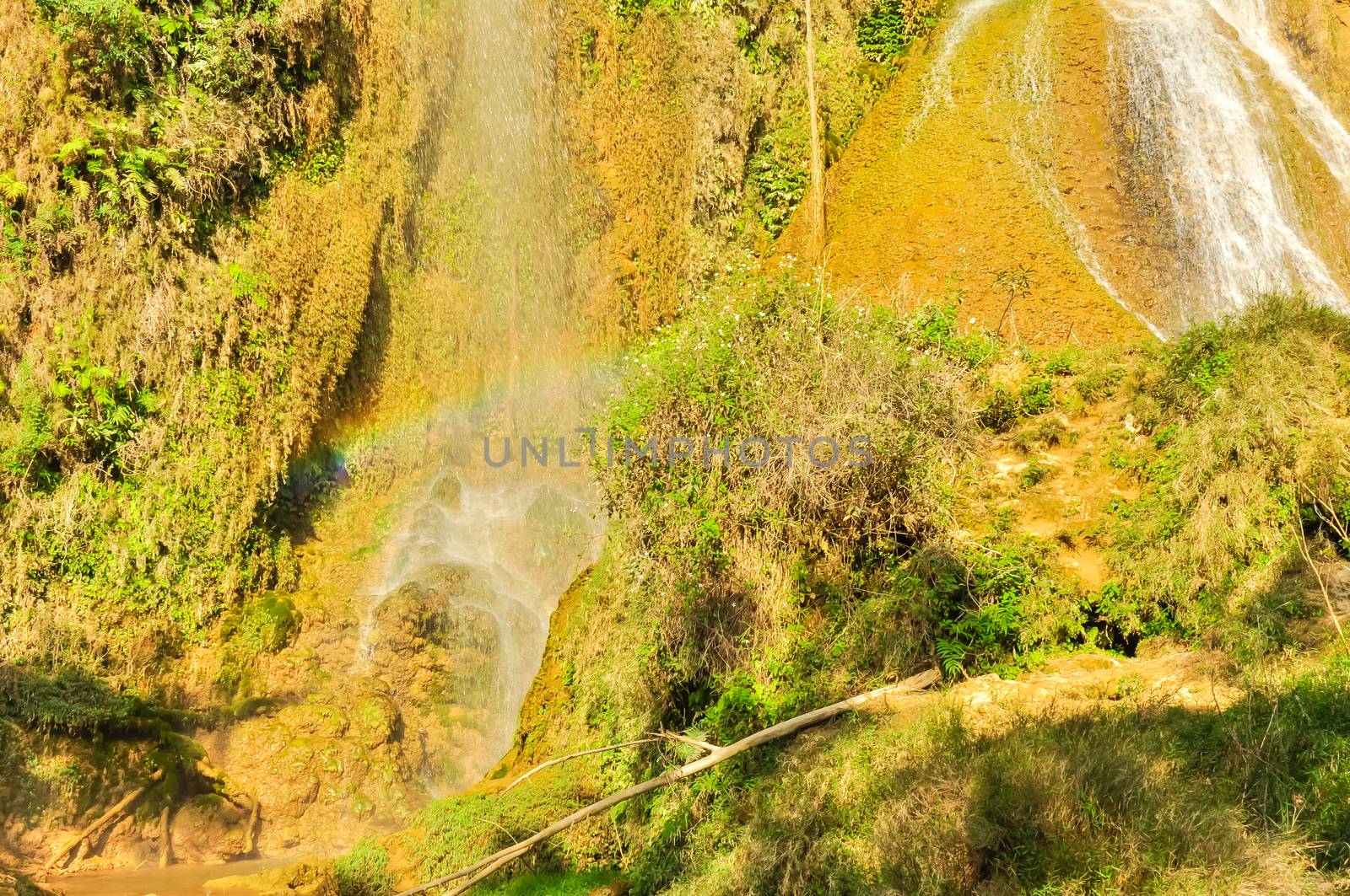 Dai Yem (Pink Blouse) waterfall in Muong Sang Commune, Moc Chau District, Son La Province. Small current fall gushes down its slope with small and medium rocks in various shapes, dazzling white