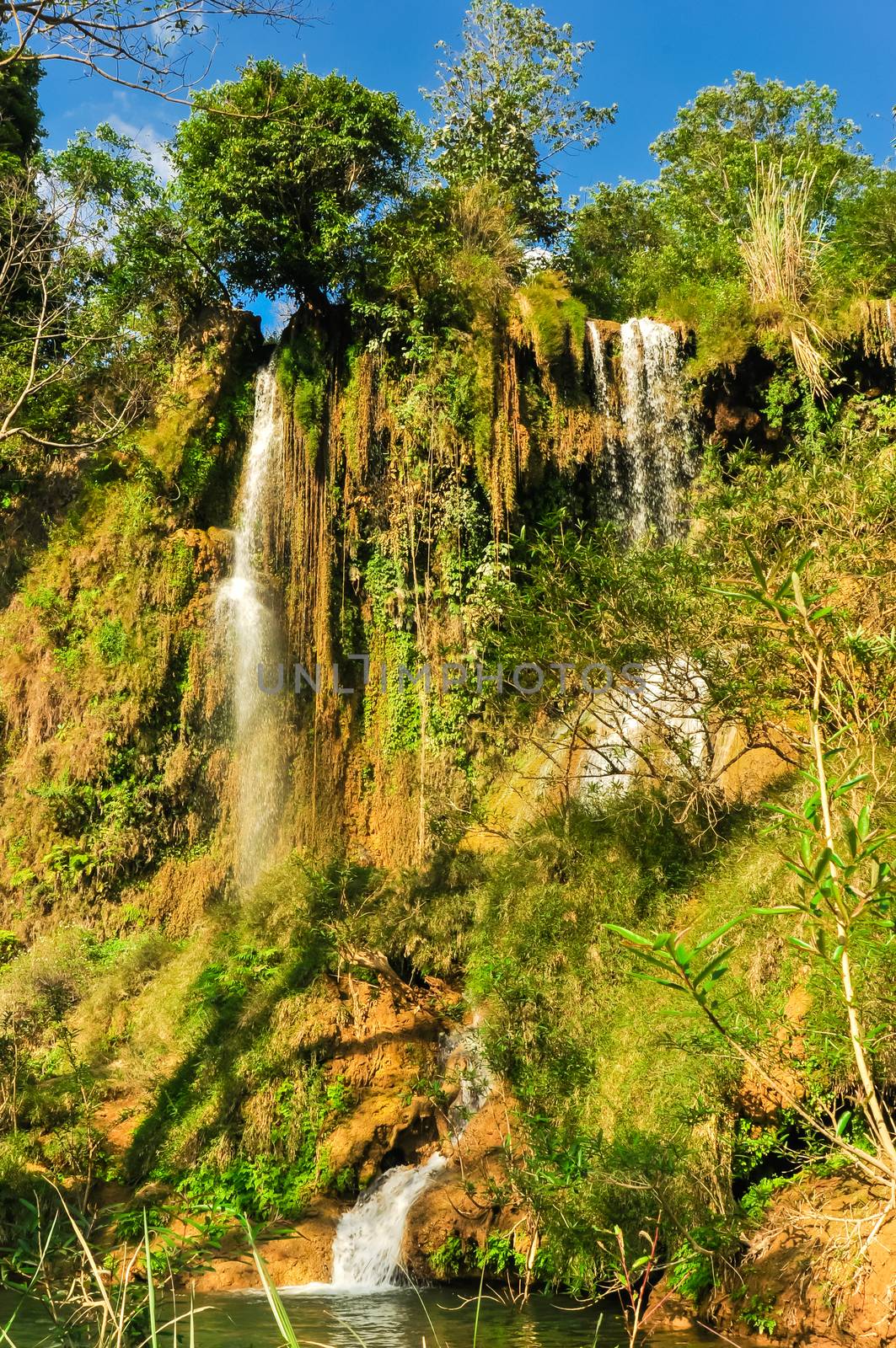Dai Yem (Pink Blouse) waterfall in Muong Sang Commune, Moc Chau District, Son La Province. Small current fall gushes down its slope with small and medium rocks in various shapes, dazzling white