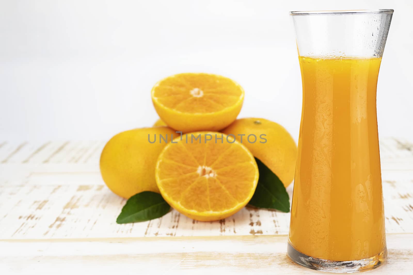 Fresh orange juice fruit drink glass over white background - tropical orange fruit for background use