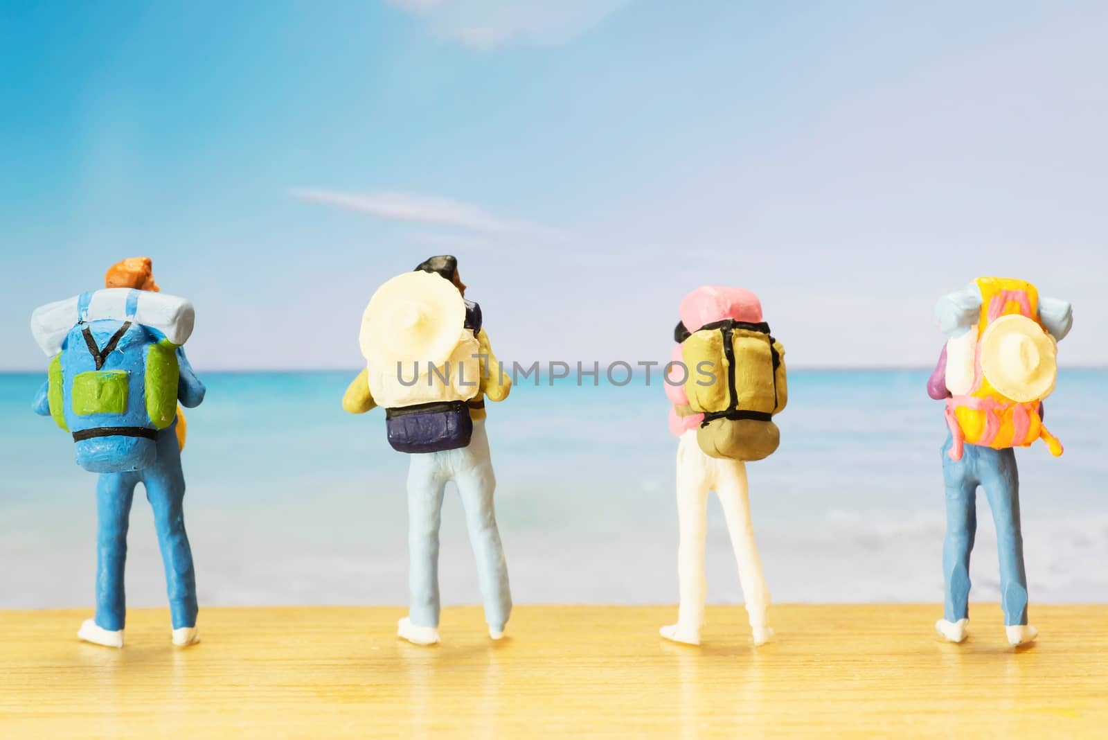 Small traveller figure for World Tourism Day background - September 27, UNWTO World Tourism Day celebration concept