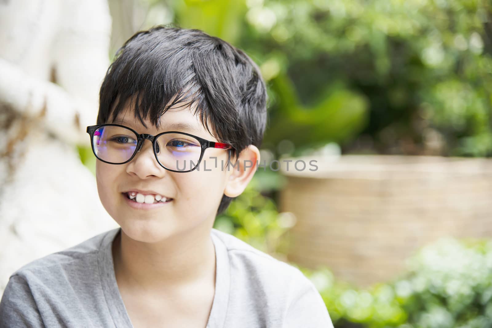 Young Thai boy smiling portrait - happy Asian boy concept