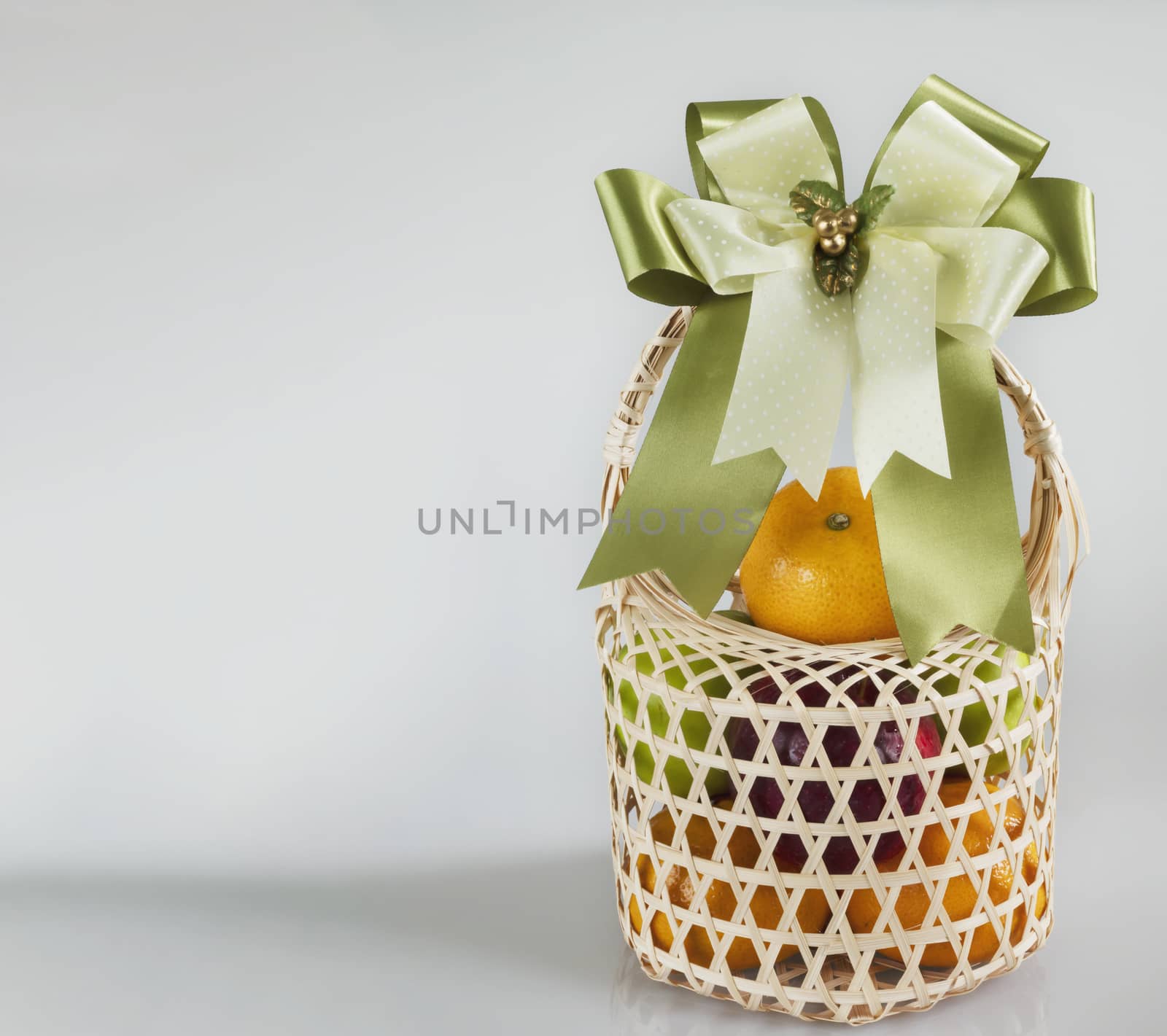 Fresh fruit souvenir in weaved bamboo package over white gray background - fresh fruit gift set for special occasion concept