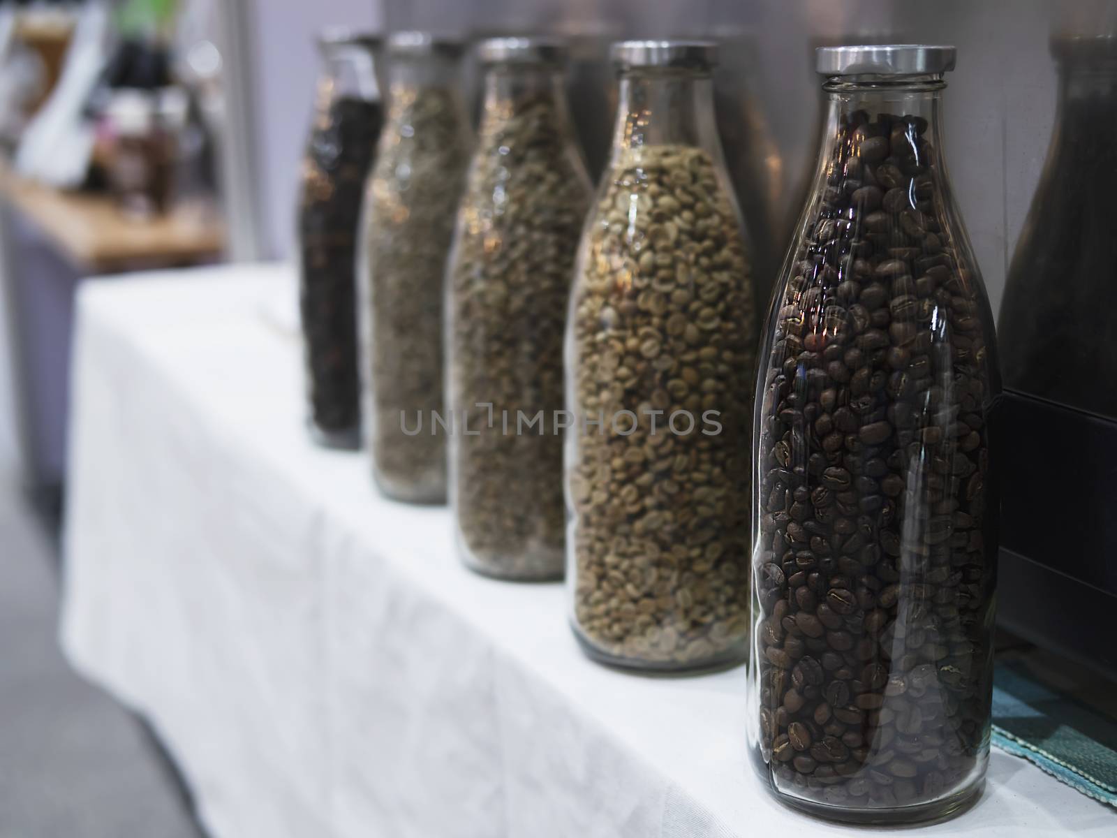 Variety fresh coffee beans in a bottle - fresh coffee decoration concept by pairhandmade