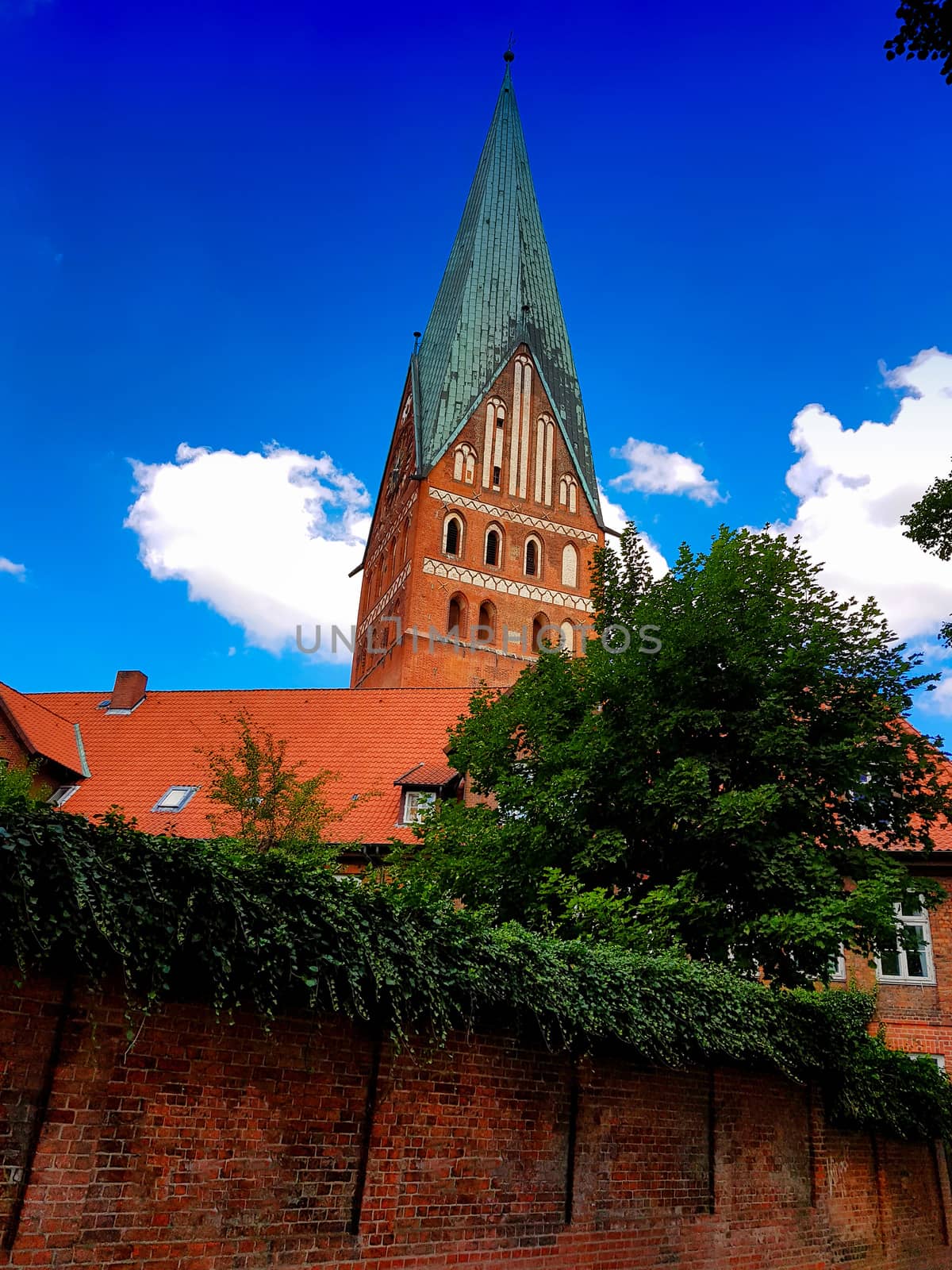 Lüneburg, Germany, Dom and old historic houses with blue sky and clouds in the background