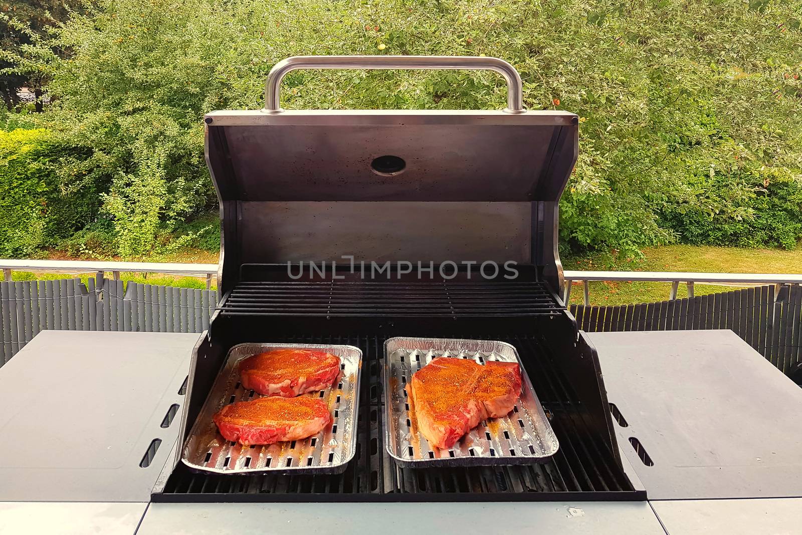 Grilling steaks on a blazing grill. Shot with selective focus