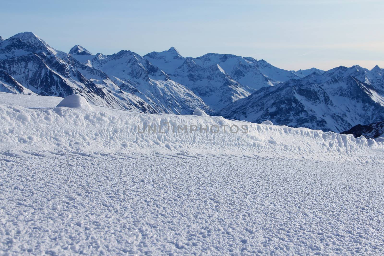 Winter mountains and slope on the skiing resort Soelden Austria