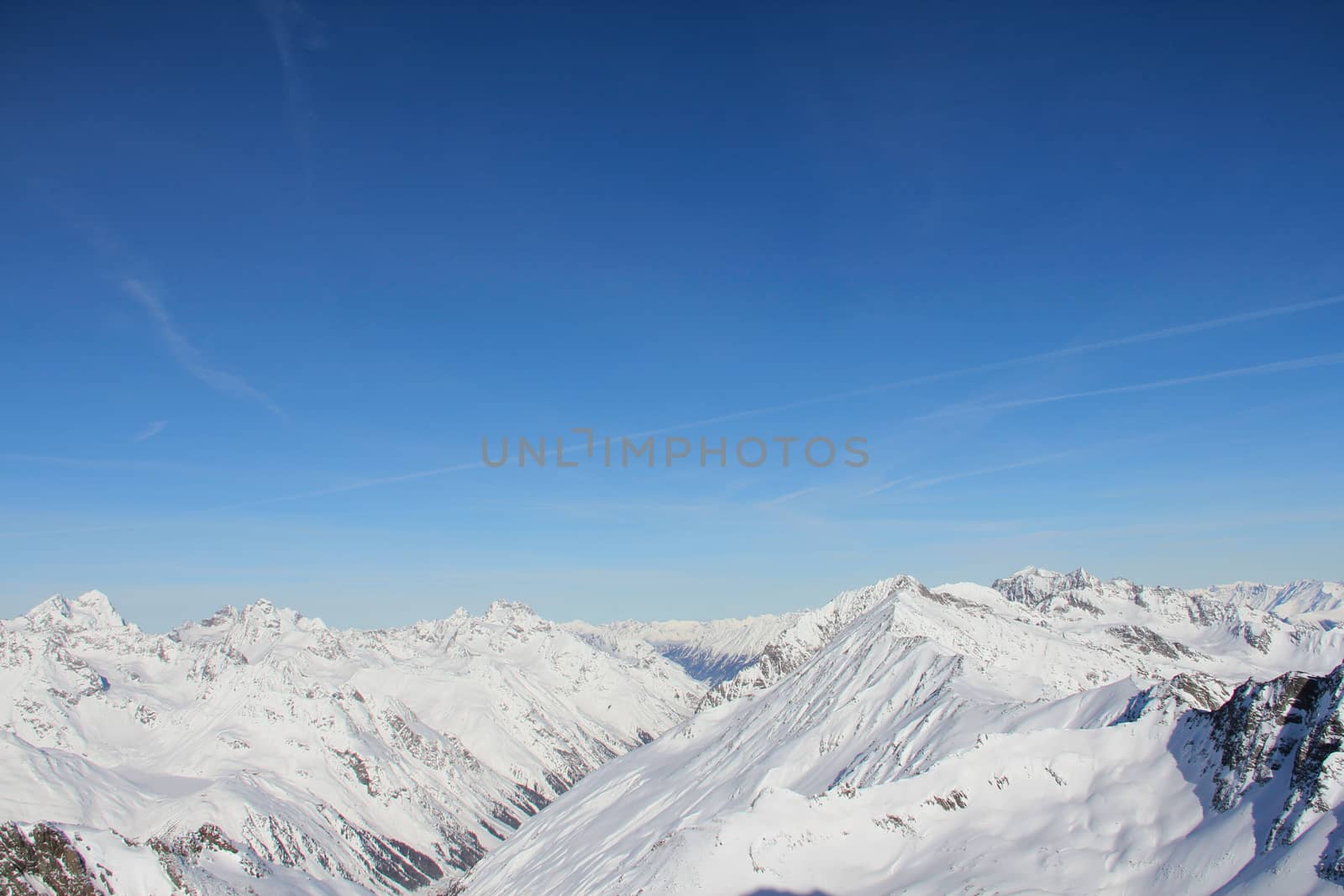 Range of winter mountain peaks at sunny day at Soelden Austria